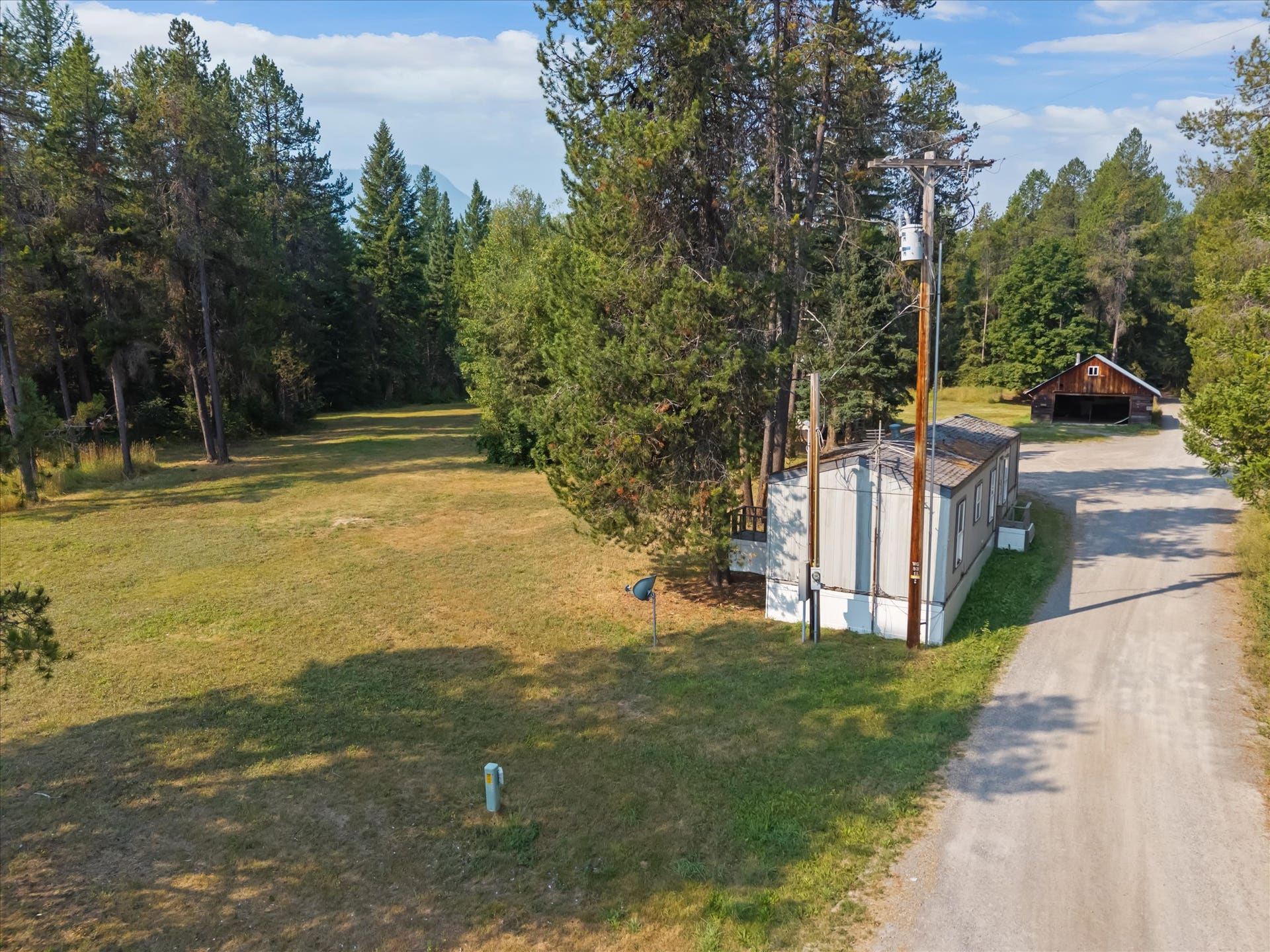 9590 US Hwy 2 E, Martin City, MT 59926 Mobile home on property