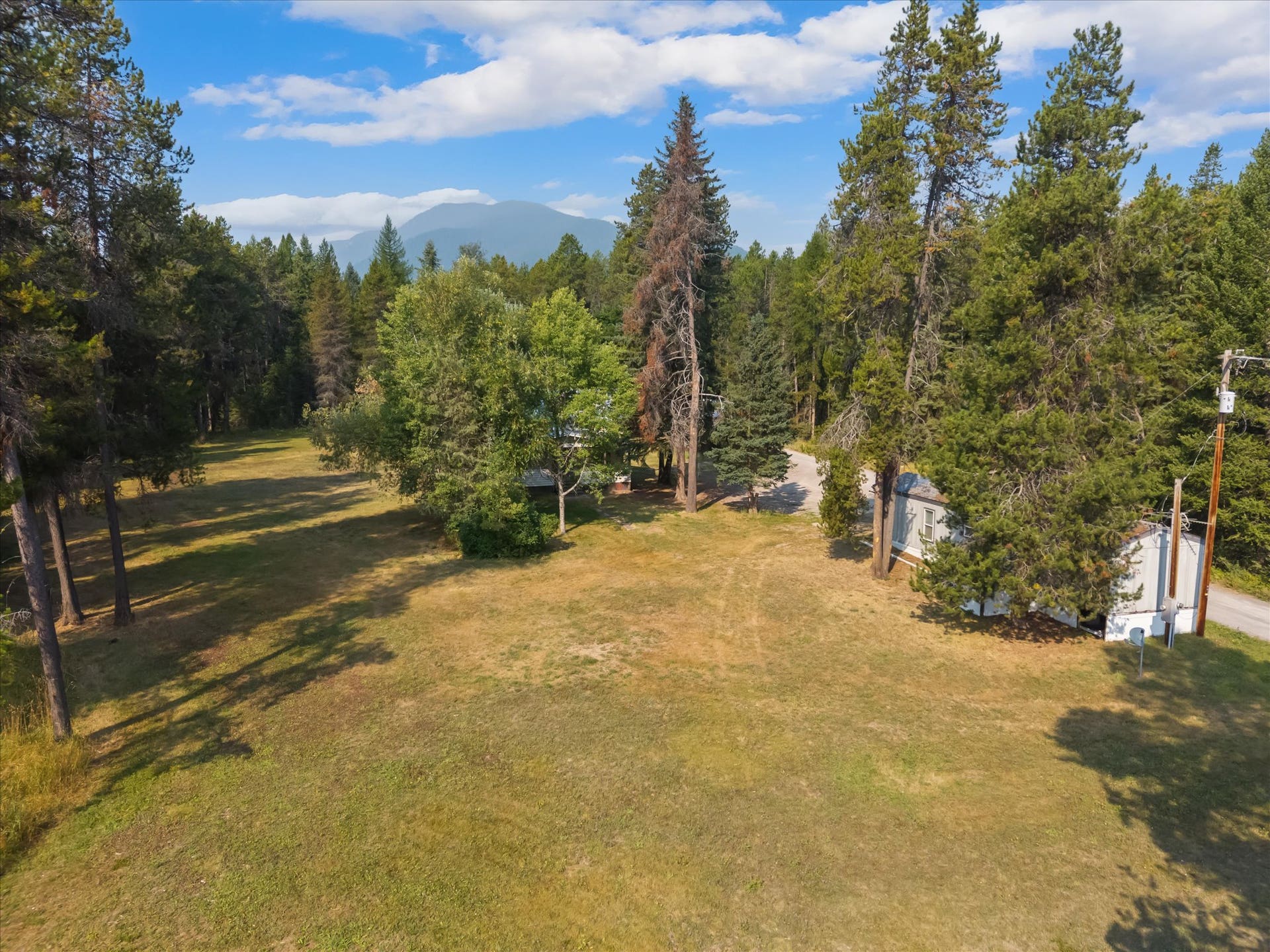 9590 US Hwy 2 E, Martin City, MT 59926 Aerial view of commercial property with Highway 2 frontage near Glacier National Park