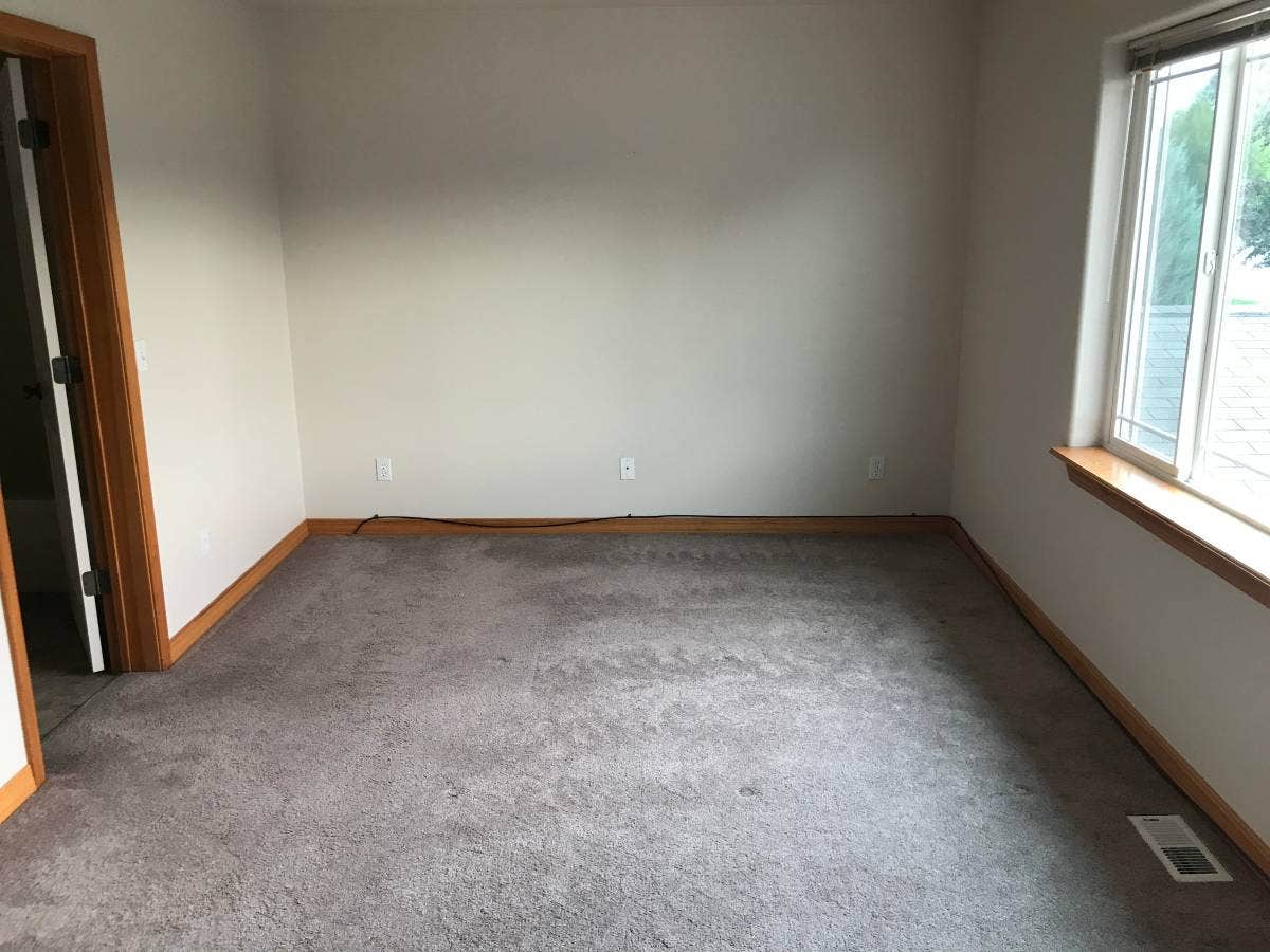 114 Sunrise Terrace, #114, Bigfork, MT 59911 Spare room featuring visible vents, baseboards, and carpet floors