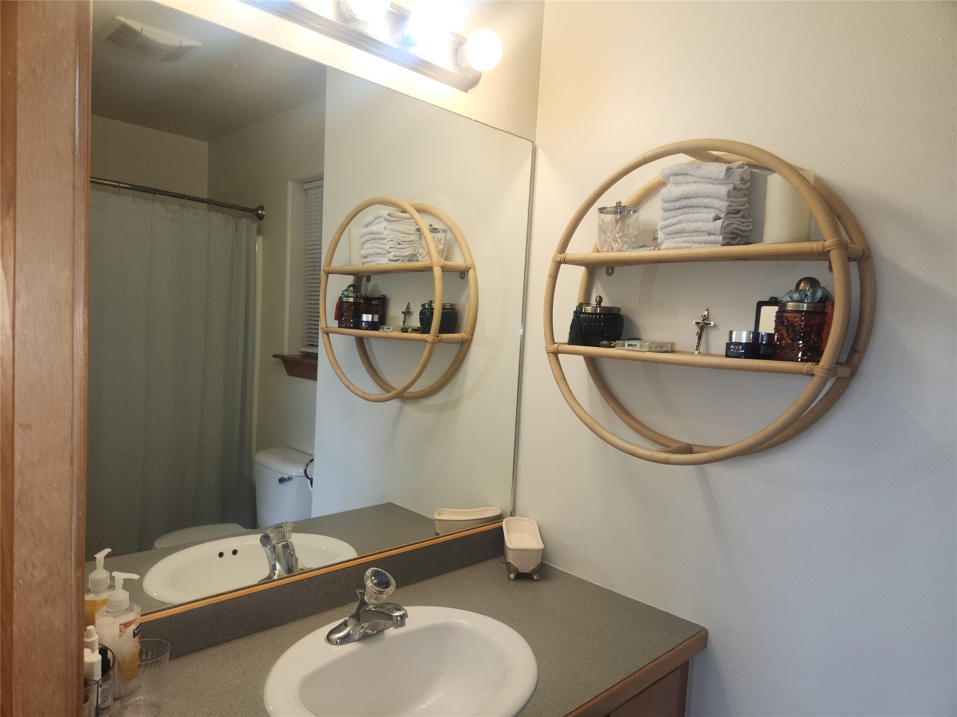 114 Sunrise Terrace, #114, Bigfork, MT 59911 Vanity with integrated sink, laminate countertop, and wood-finish cabinetry