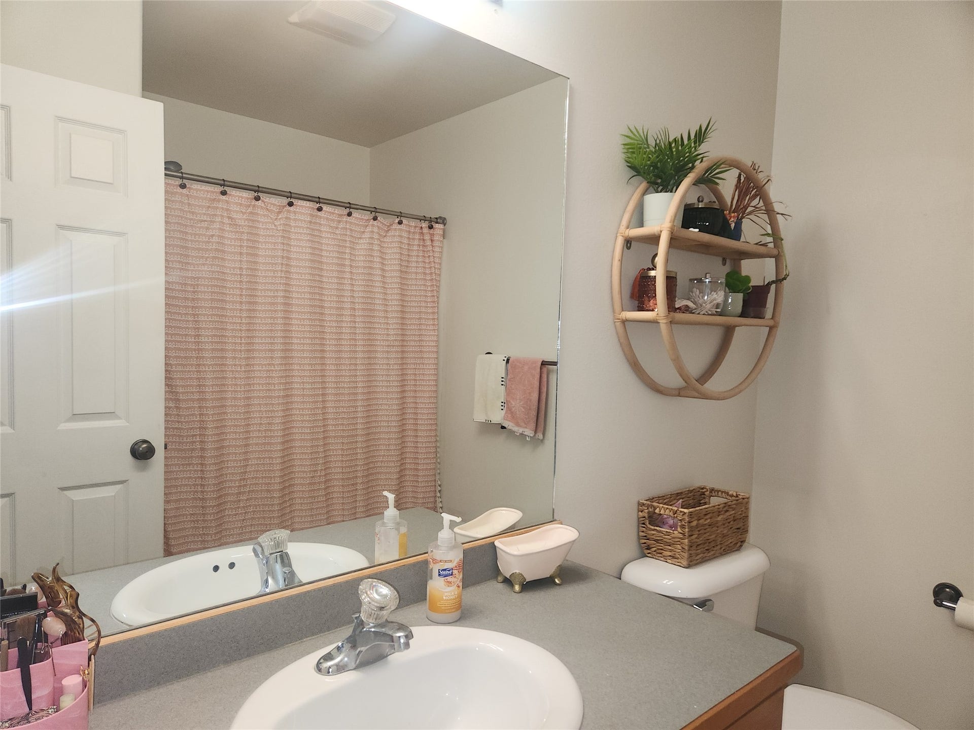 114 Sunrise Terrace, #114, Bigfork, MT 59911 Recessed vanity sink with chrome faucet, generous countertop space, and wall-mounted mirror