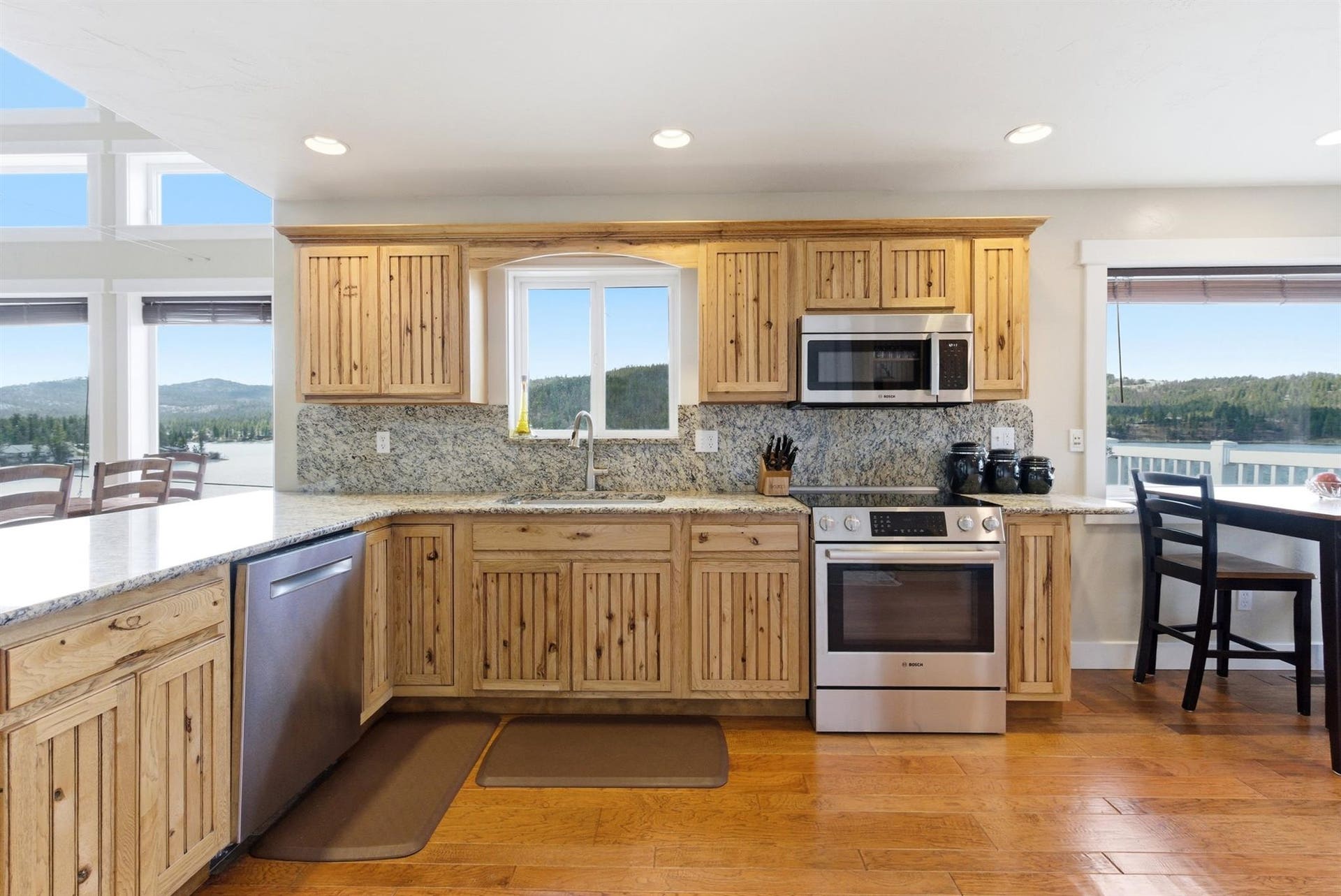 45 Roybals Way, Kalispell, MT 59901 Kitchen with stainless steel appliances, plenty of natural light, light wood-type flooring, a peninsula, and recessed lighting