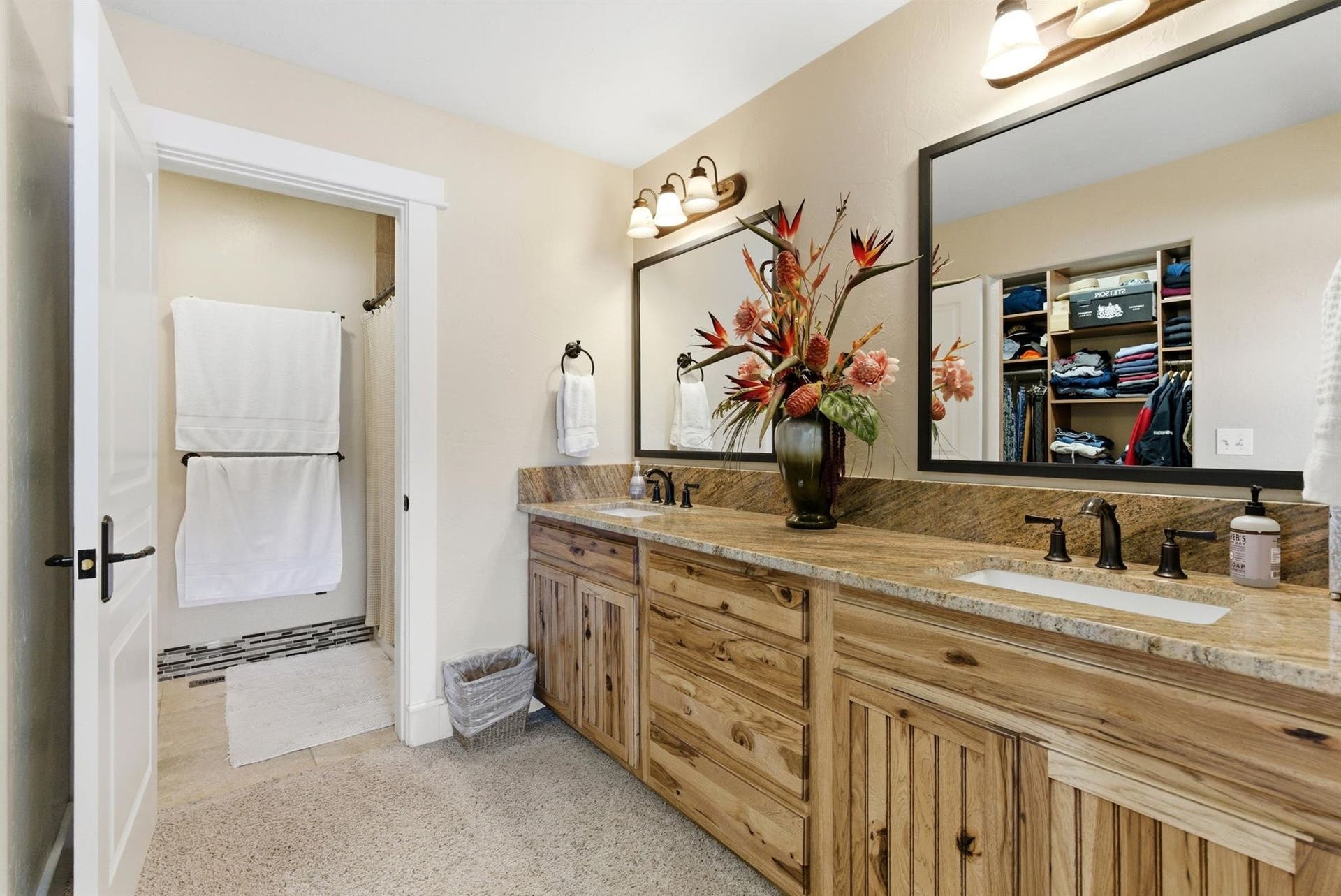 45 Roybals Way, Kalispell, MT 59901 Full bathroom featuring double vanity, a spacious closet, and a shower with shower curtain