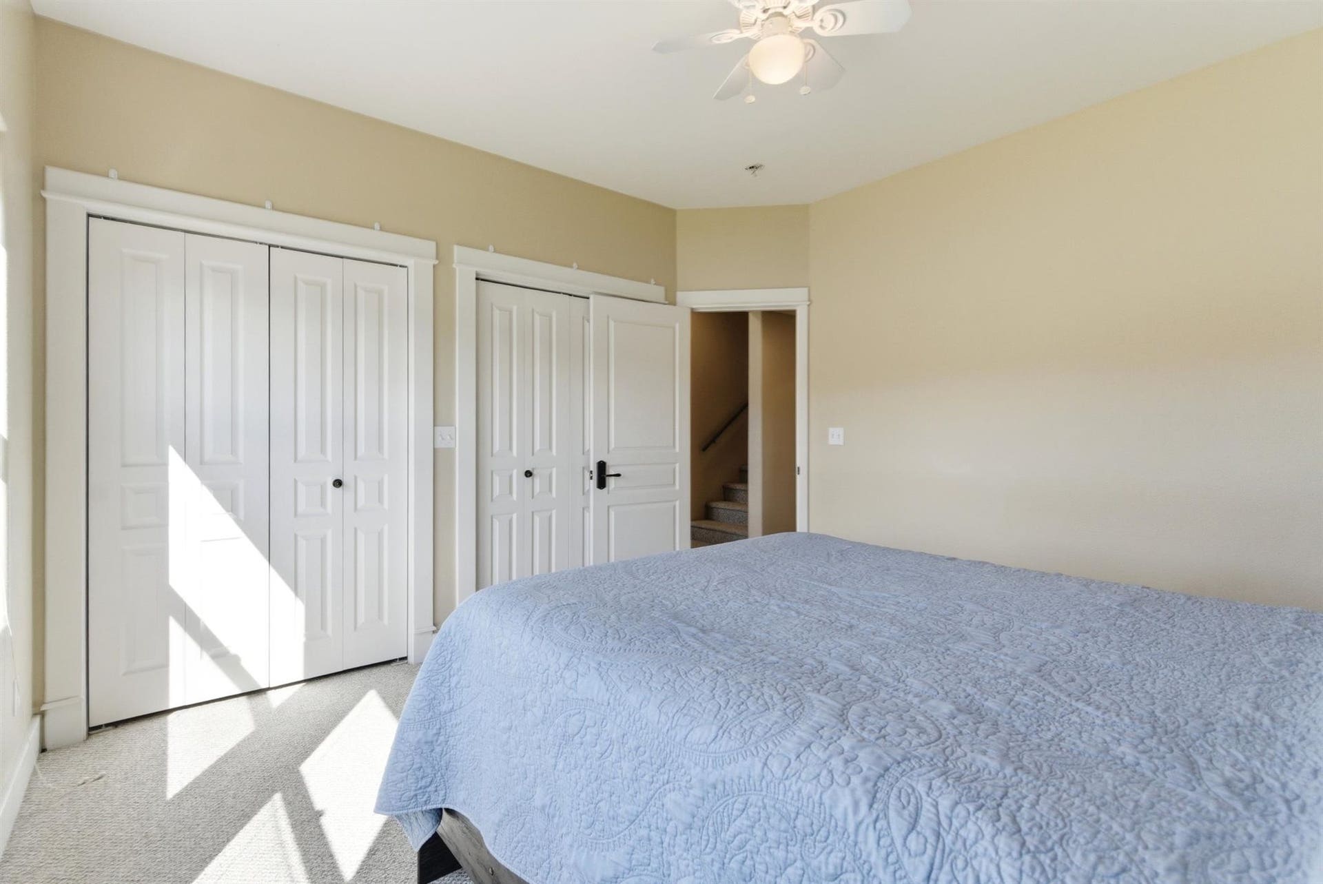 45 Roybals Way, Kalispell, MT 59901 Bedroom featuring multiple closets, light colored carpet, and ceiling fan