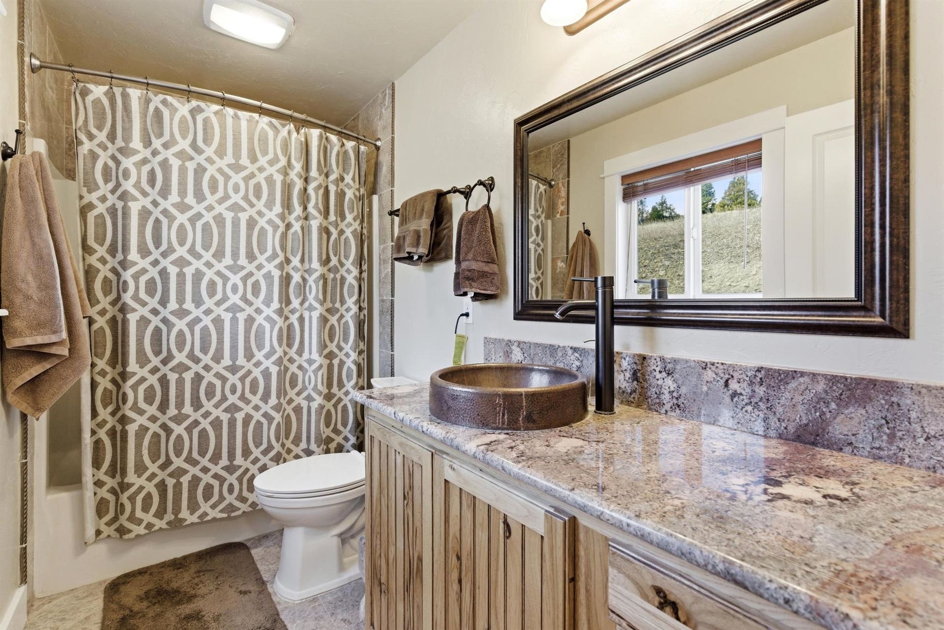 45 Roybals Way, Kalispell, MT 59901 Full bathroom featuring vanity and shower / tub combo