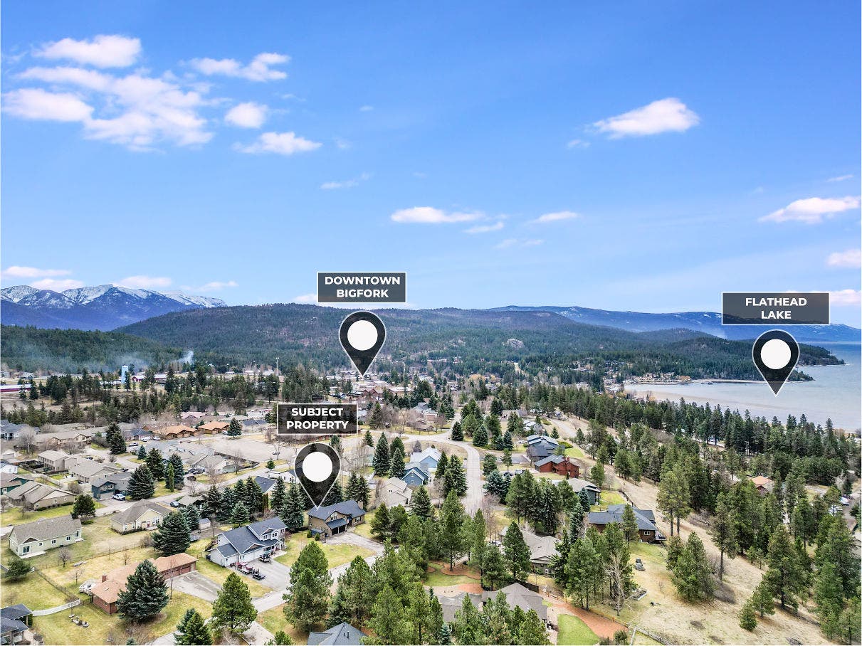 163 Crestview Drive, Bigfork, MT 59911 Wide-angle aerial view illustrating the short distance from the subject property to Flathead Lake and the charming amenities of Downtown Bigfork
