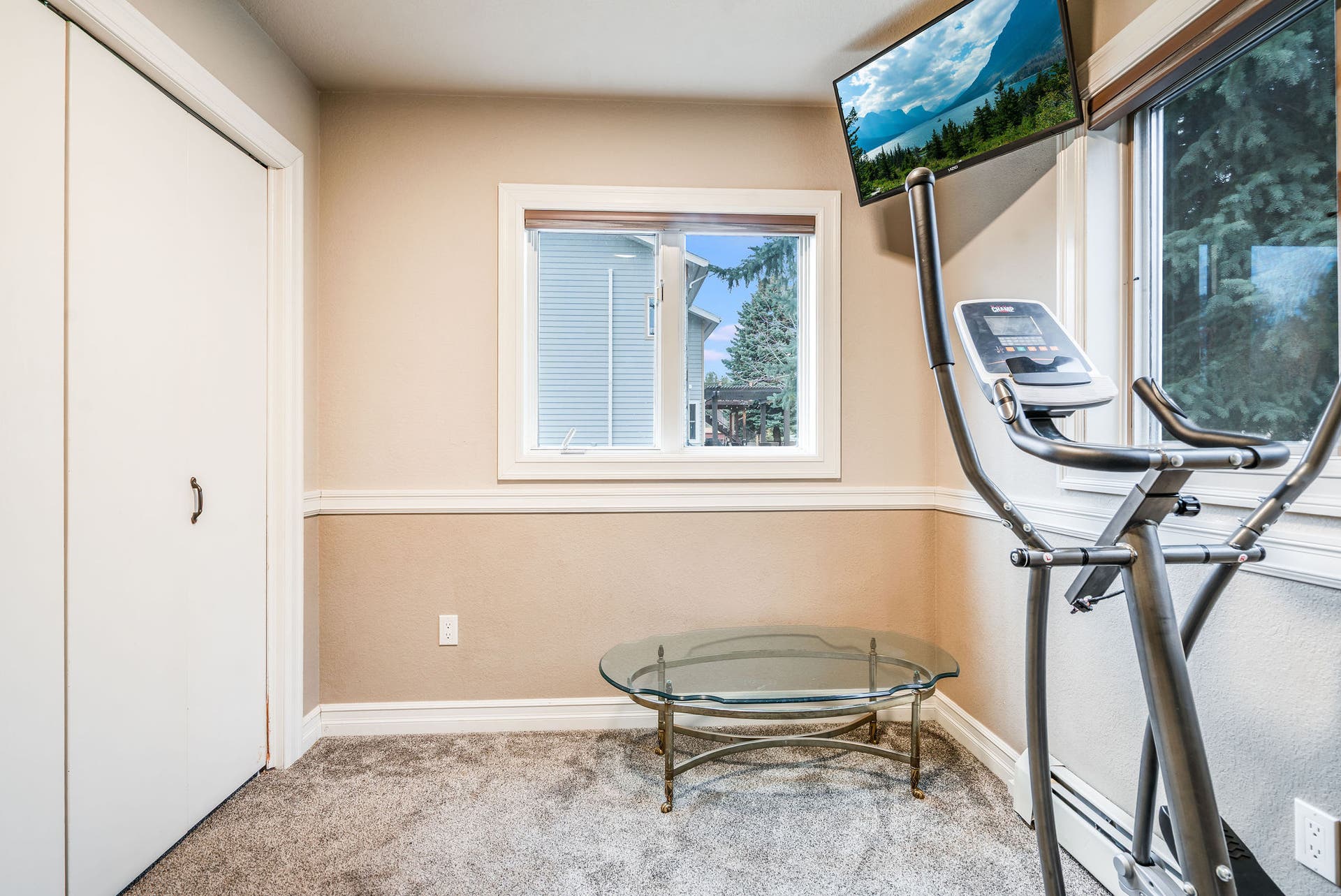 163 Crestview Drive, Bigfork, MT 59911 Bright bedroom with ample closet storage, perfect for a home office or exercise space