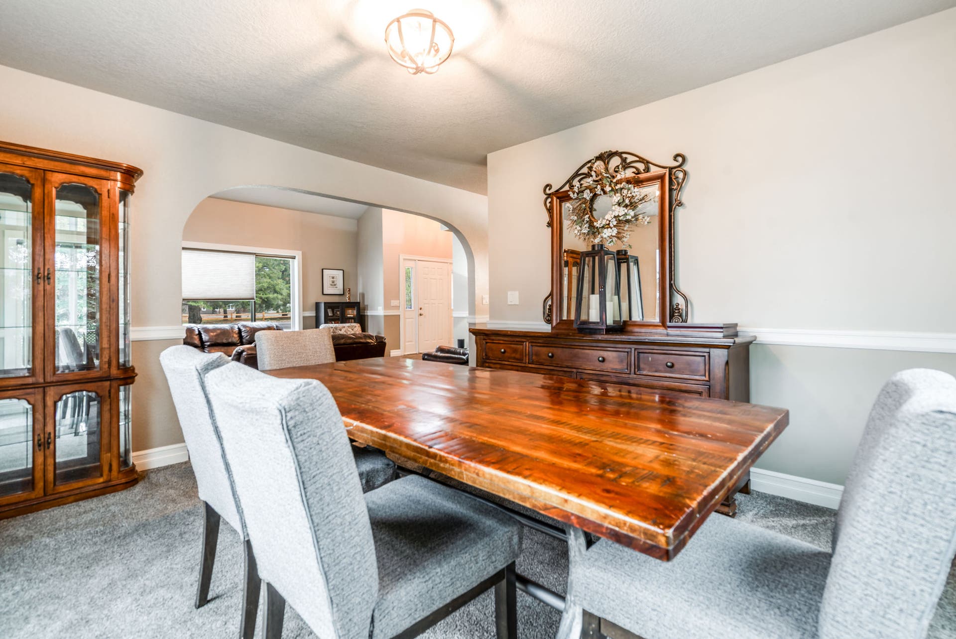 163 Crestview Drive, Bigfork, MT 59911 Light-filled dining area showcasing the open arched transition into the Great Room