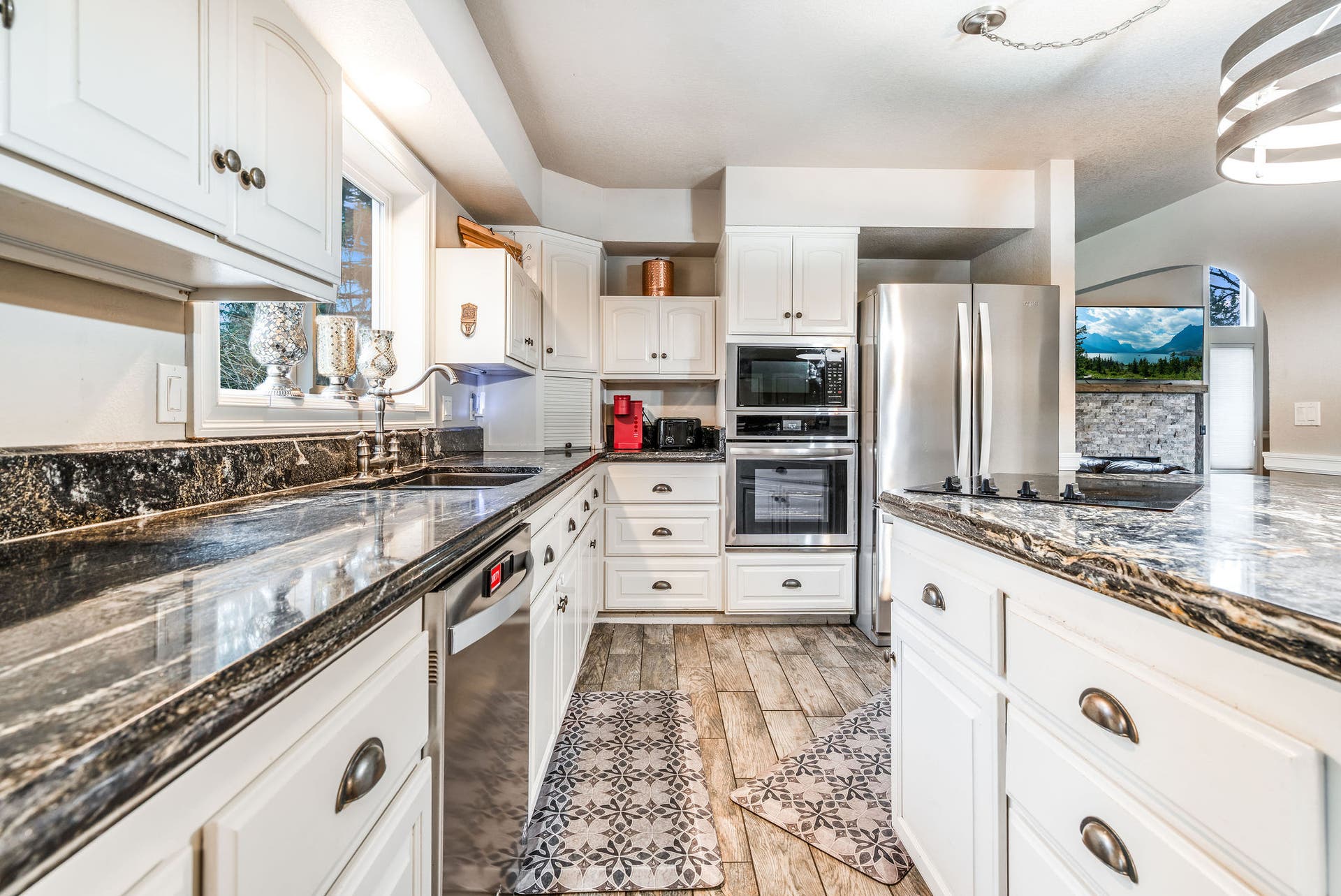 163 Crestview Drive, Bigfork, MT 59911 Chefs kitchen equipped with a double wall oven and built-in microwave for easy entertaining
