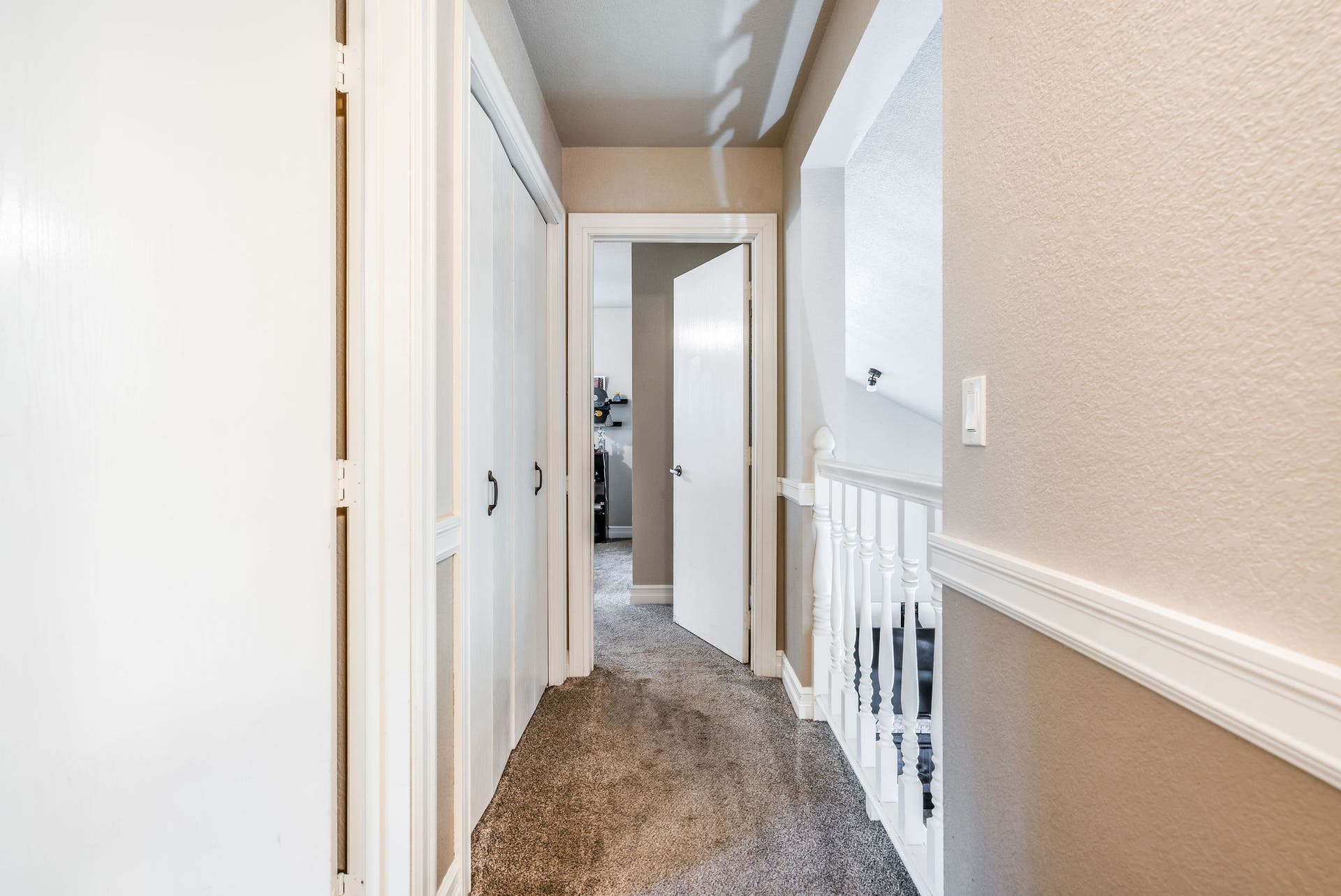 163 Crestview Drive, Bigfork, MT 59911 Upper-level landing with a linen closet and views overlooking the living area below