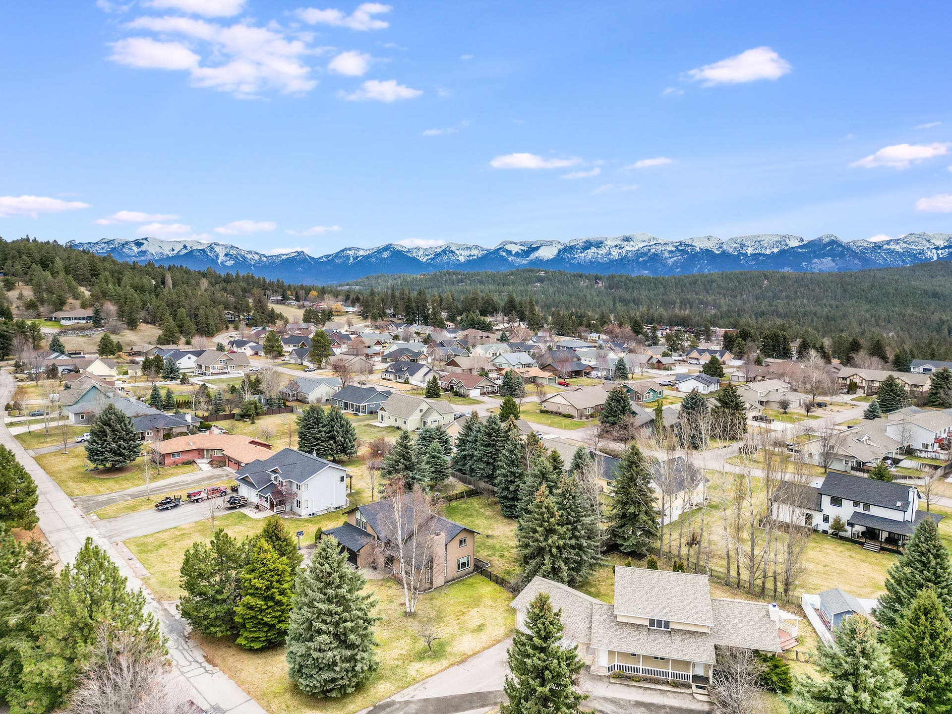 163 Crestview Drive, Bigfork, MT 59911 Aerial perspective of the peaceful residential setting showcasing the Swan Mountain Range in the distance