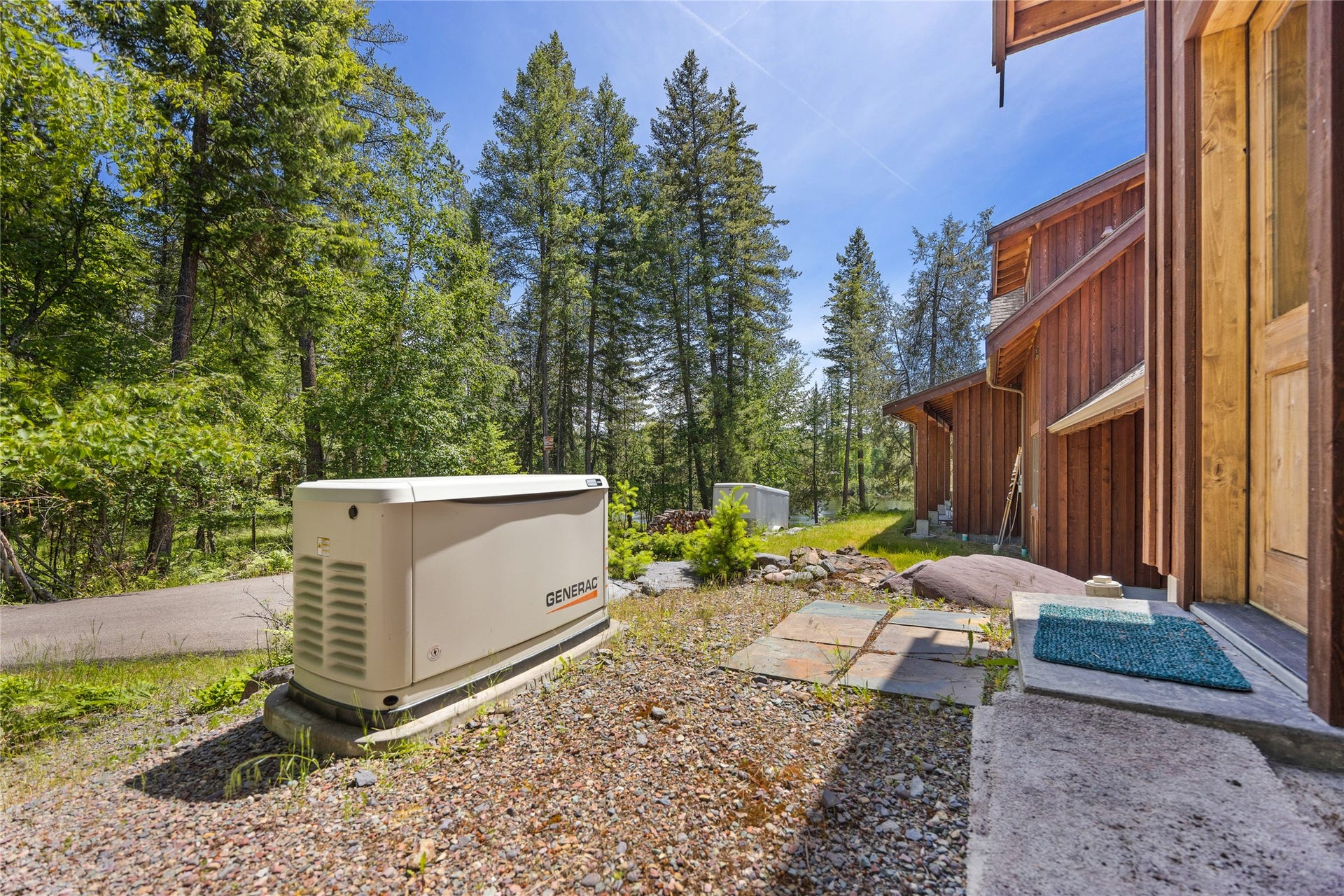 234 Williams Lane, Bigfork, MT 59911 Off laundry room entrance from east side of home, where the toys are parked
