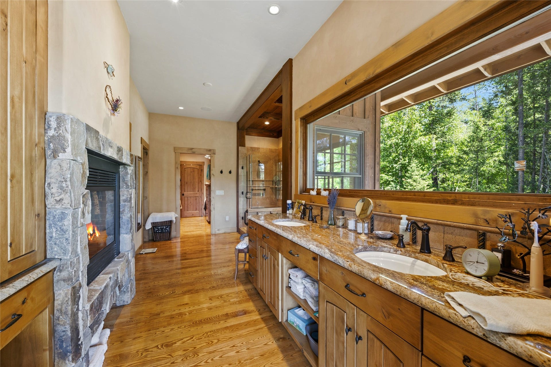 234 Williams Lane, Bigfork, MT 59911 Double sided fireplace, soft lighting, separate slipper tub, tiled shower, amazing ambiance