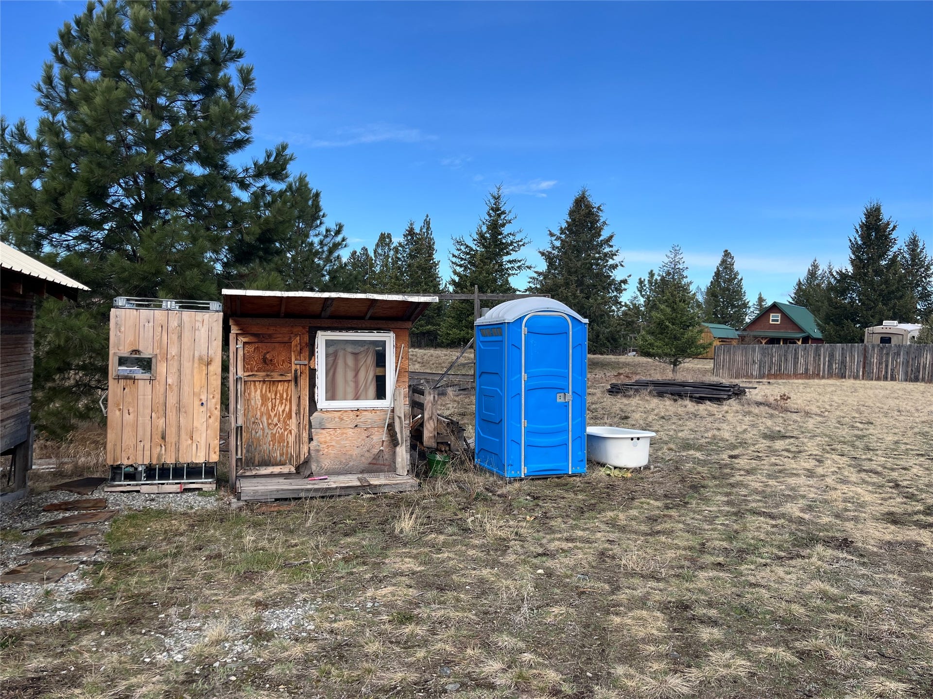 198 Acres Lane, Eureka, MT 59917 Outdoor shower, changing room and self-contained outhouse.