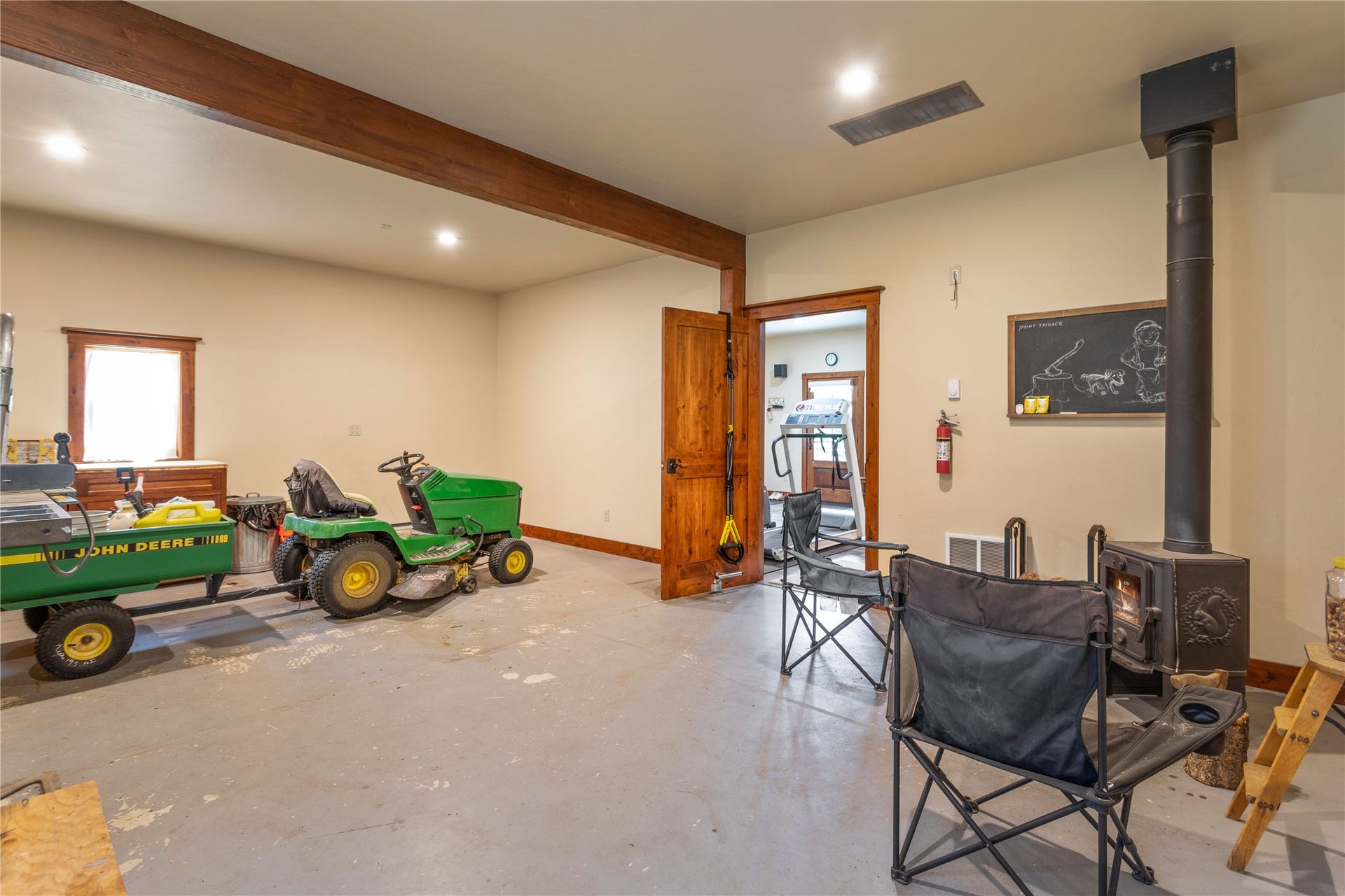 12284 Cygnet Way, Bigfork, MT 59911 A great 'Guy Cave' with storage, shop space and a gather round wood stove for those long winter evenings