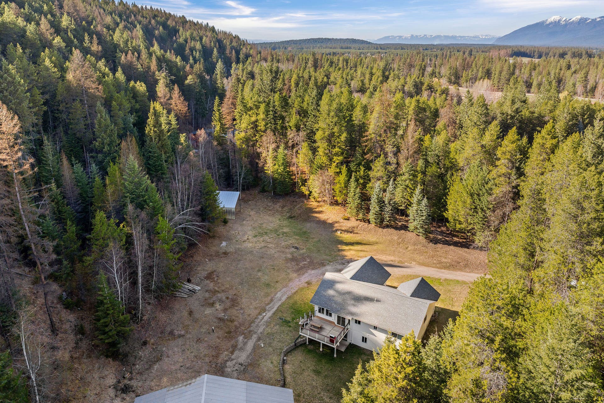 620 Swan River Road, Bigfork, MT 59911 Aerial of house and meadow