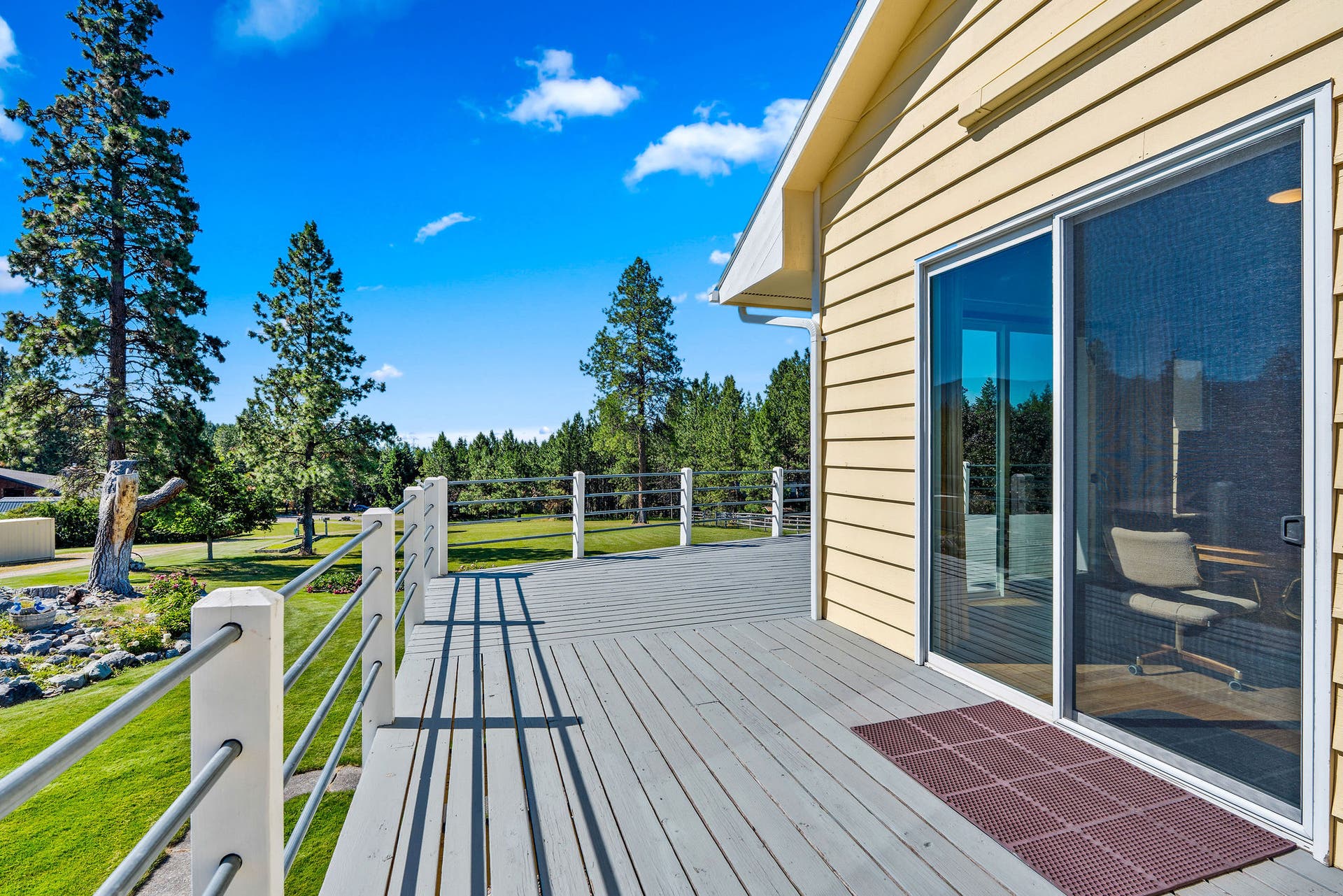 33676 Hilltop Terrace, Bigfork, MT 59911 Wood deck w/ metal pipe railing
