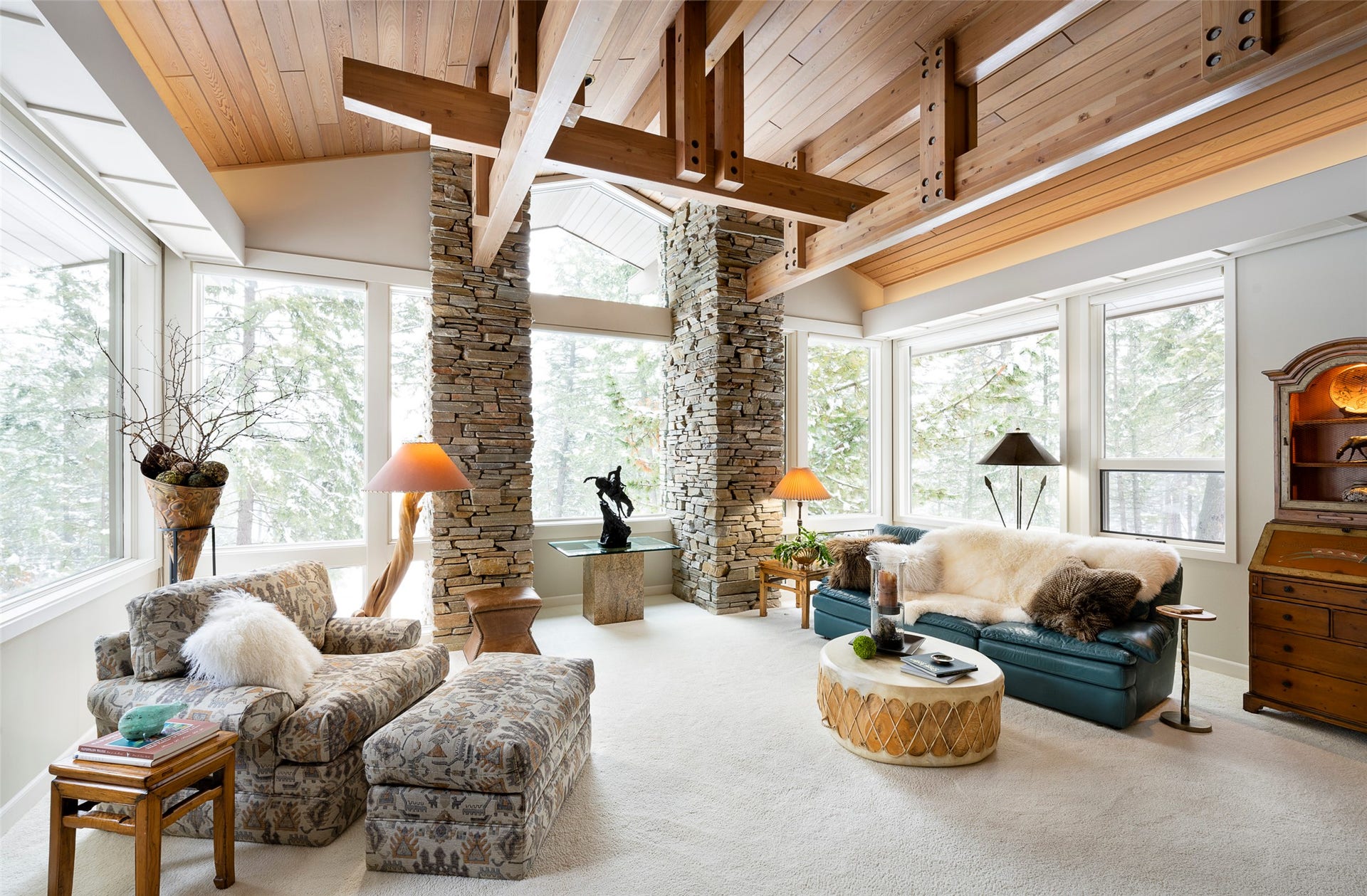 137 & 133 Eagle Bend Drive, Bigfork, MT 59911 Great room with timber beams, rockwork, oversized windows