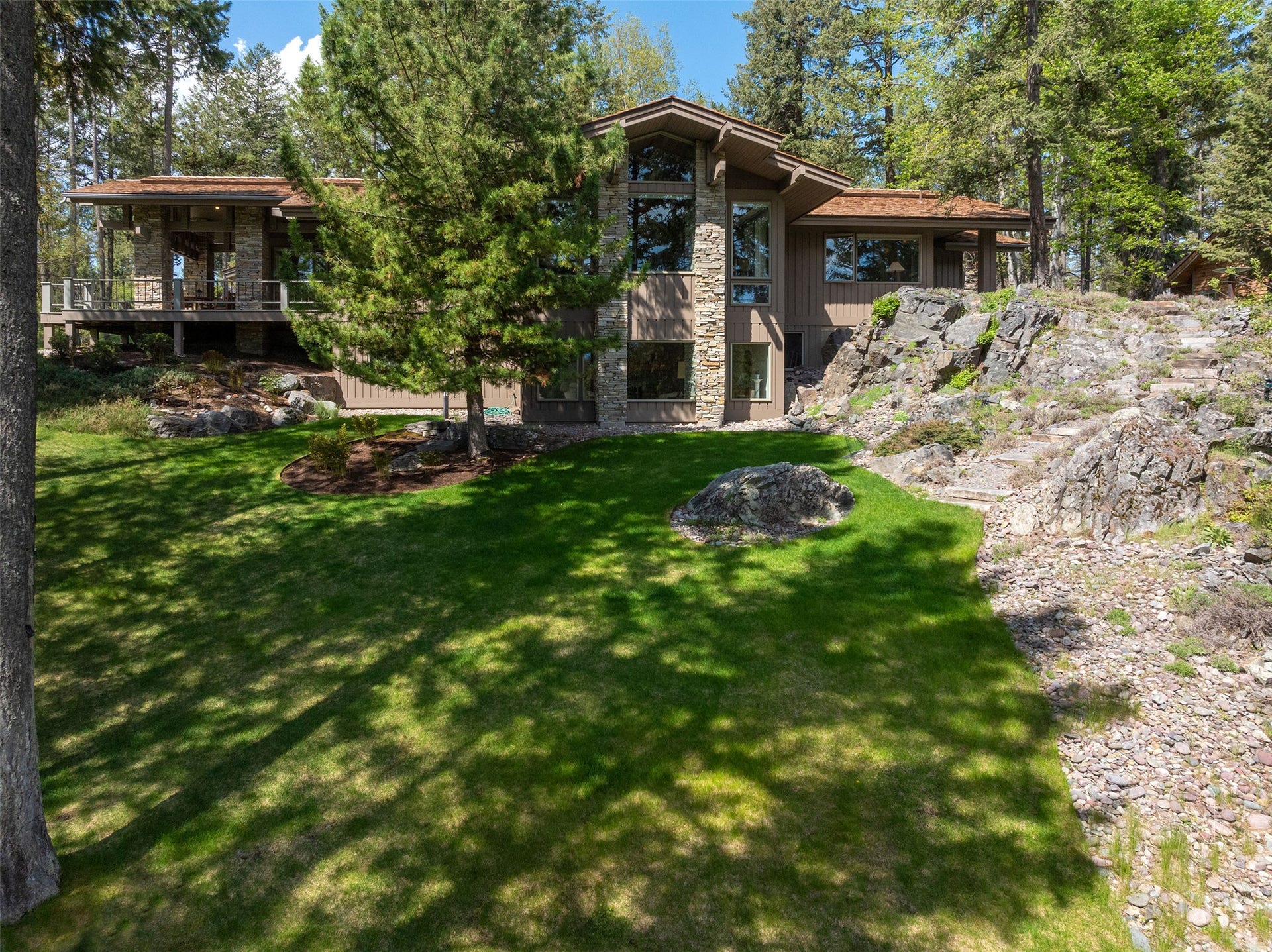 137 & 133 Eagle Bend Drive, Bigfork, MT 59911 Architecturally designed to take in the views and blend with the natural environment.