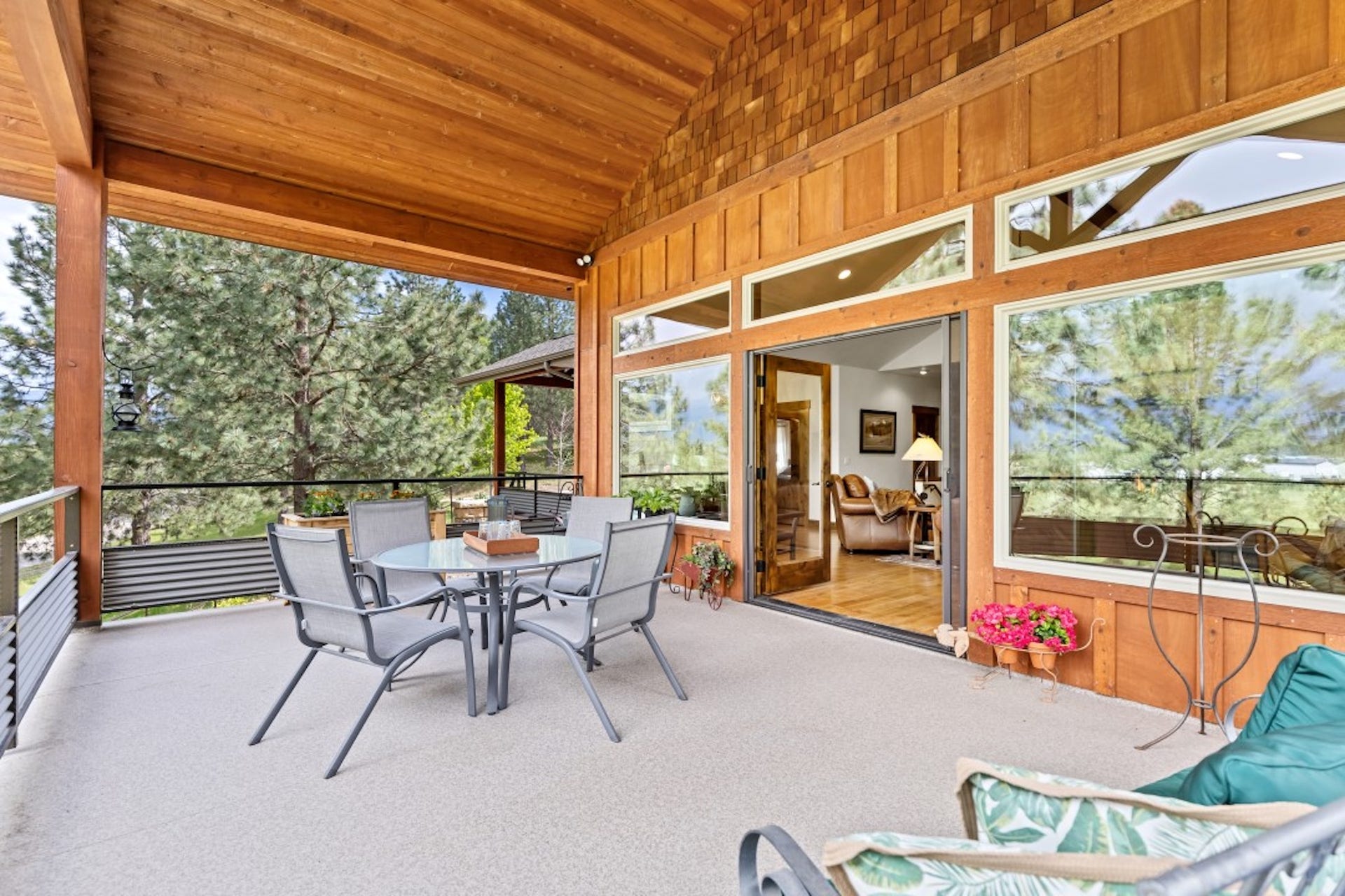 110 Conifer Lane, Bigfork, MT 59911 outdoor dining space, lofted ceiling, and a patio