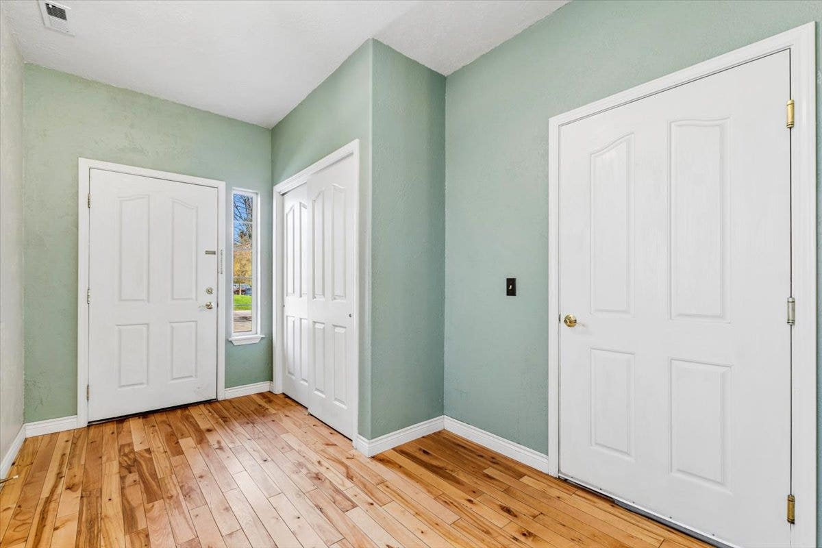 108 Sunrise Terrace, #D, Bigfork, MT 59911 Front entryway with hardwood flooring