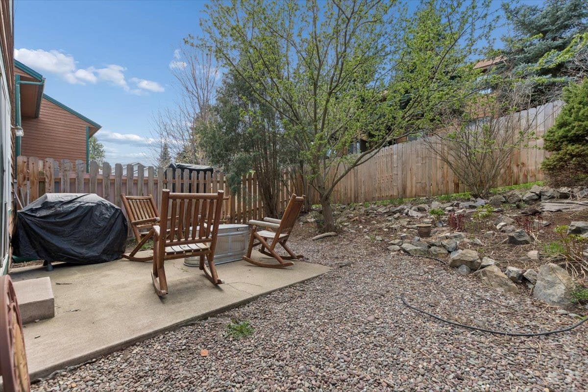 108 Sunrise Terrace, #D, Bigfork, MT 59911 Fenced back yard with landscaping