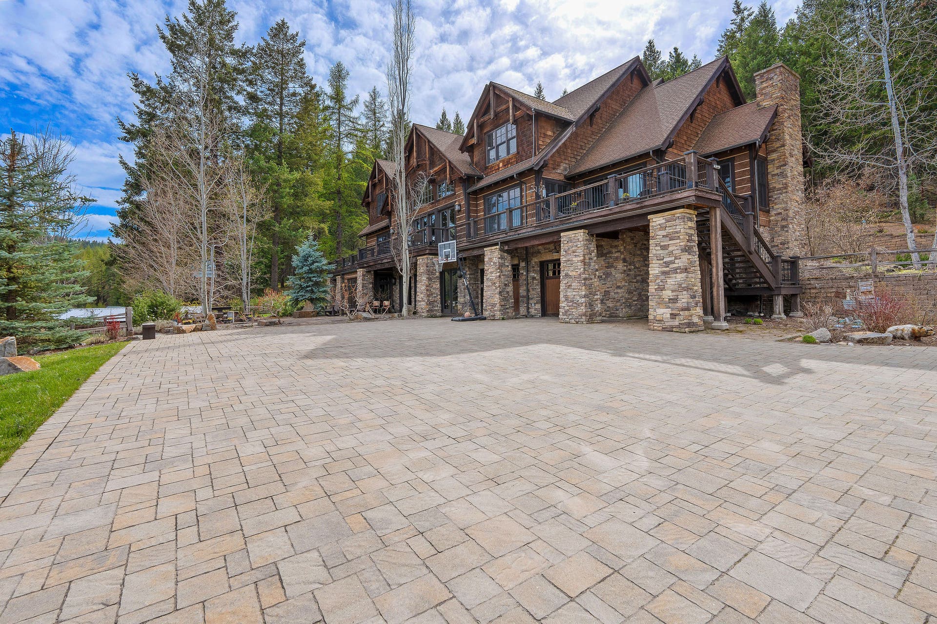 310 Rocky Woods Lane, Bigfork, MT 59911 Spacious with room as a sports court, stairs access to deck