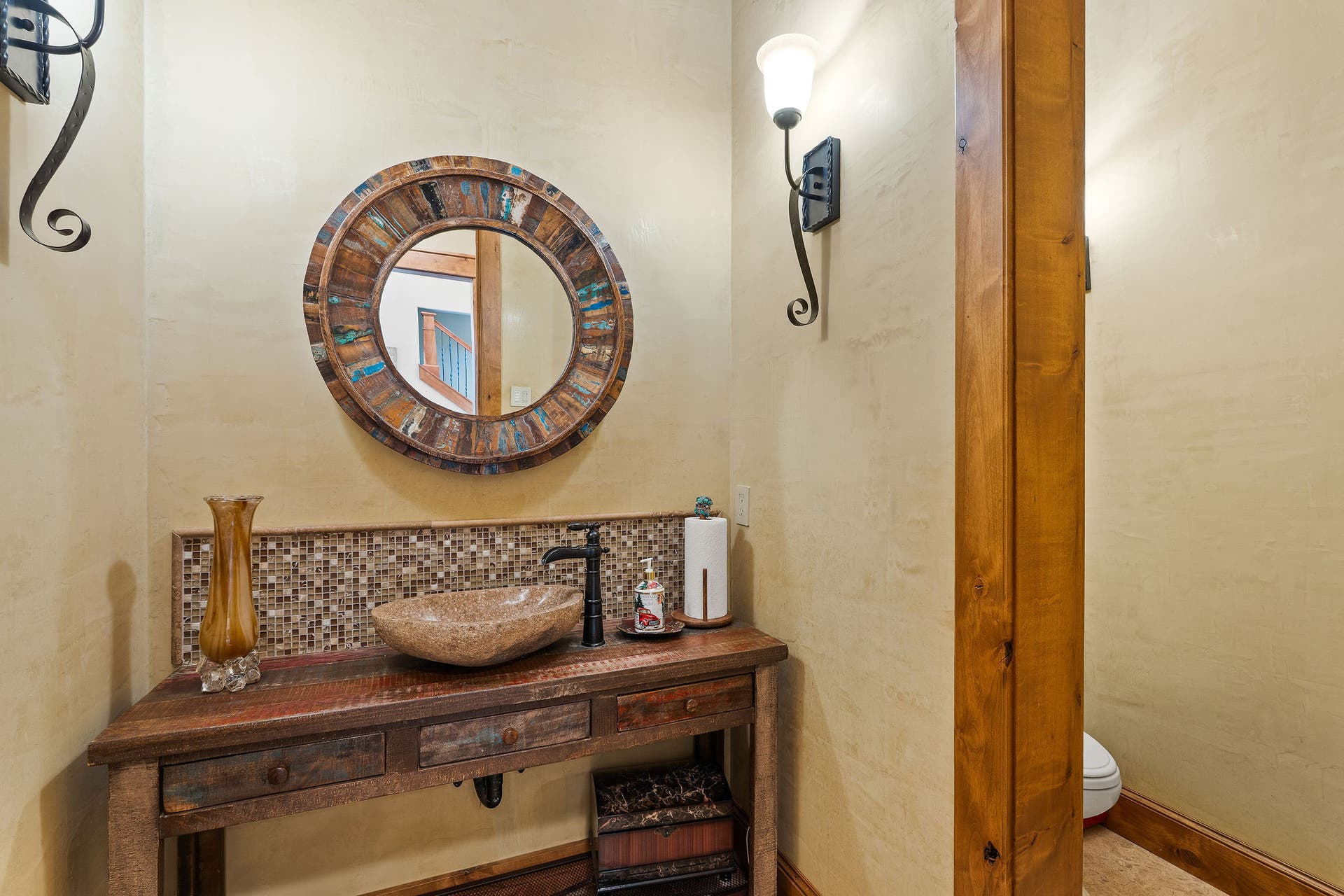310 Rocky Woods Lane, Bigfork, MT 59911 Guest powder room with radiant tile flooring & custom vanity