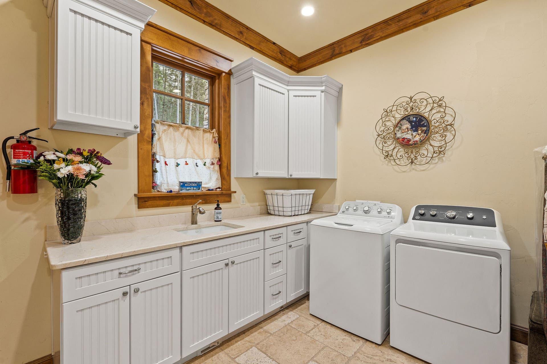 310 Rocky Woods Lane, Bigfork, MT 59911 Accessed from Primary Suite & main level hallway, granite countertops, tile flooring