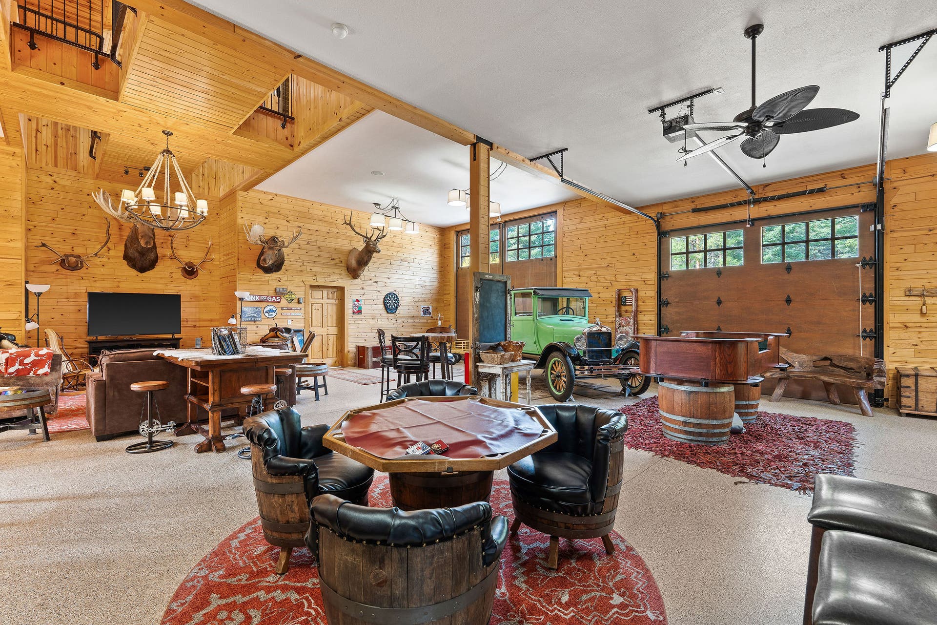 310 Rocky Woods Lane, Bigfork, MT 59911 Event room with wet bar, pool table, TV, cabinets, coffee bar