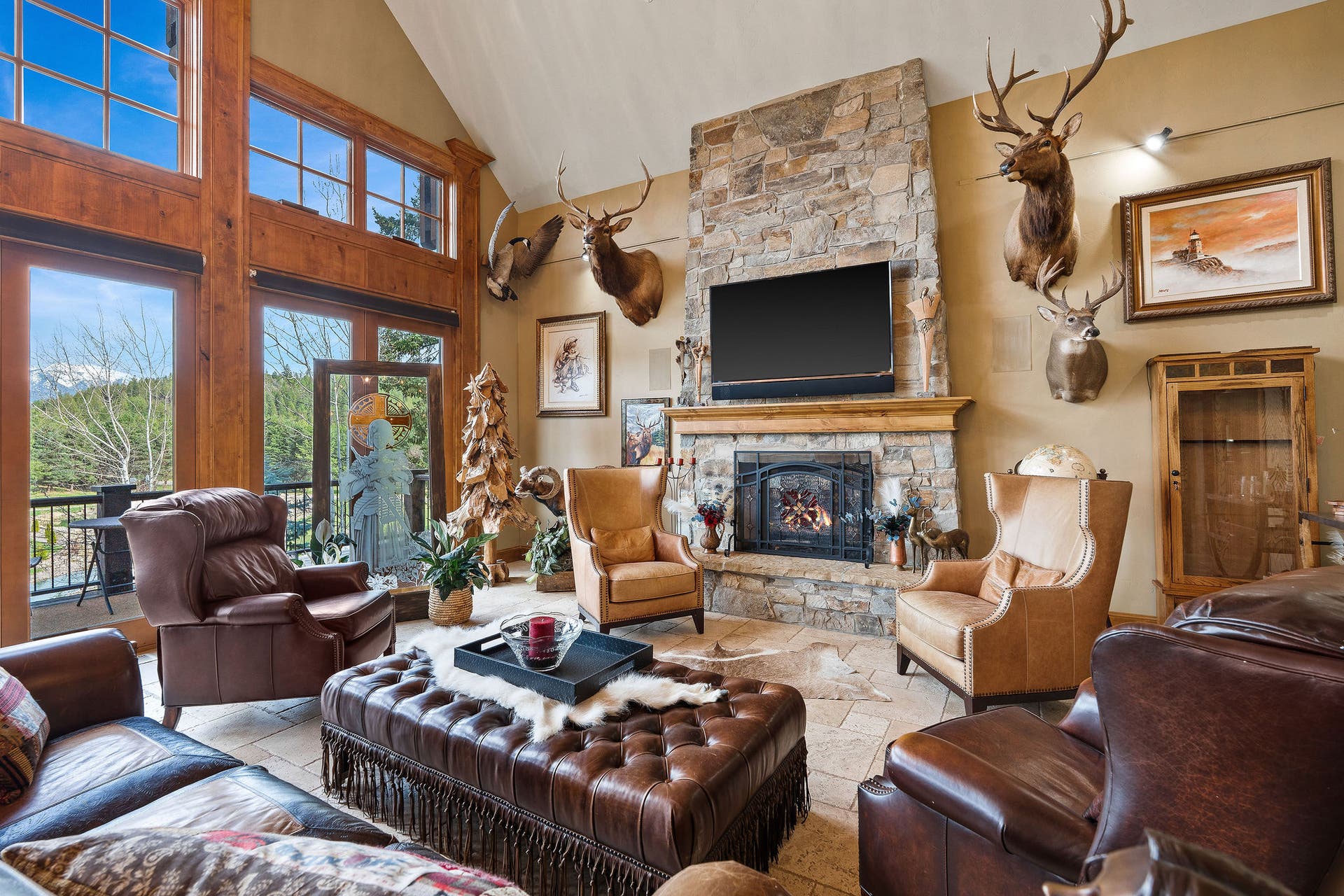 310 Rocky Woods Lane, Bigfork, MT 59911 Floor to ceiling fireplace & exterior access to deck