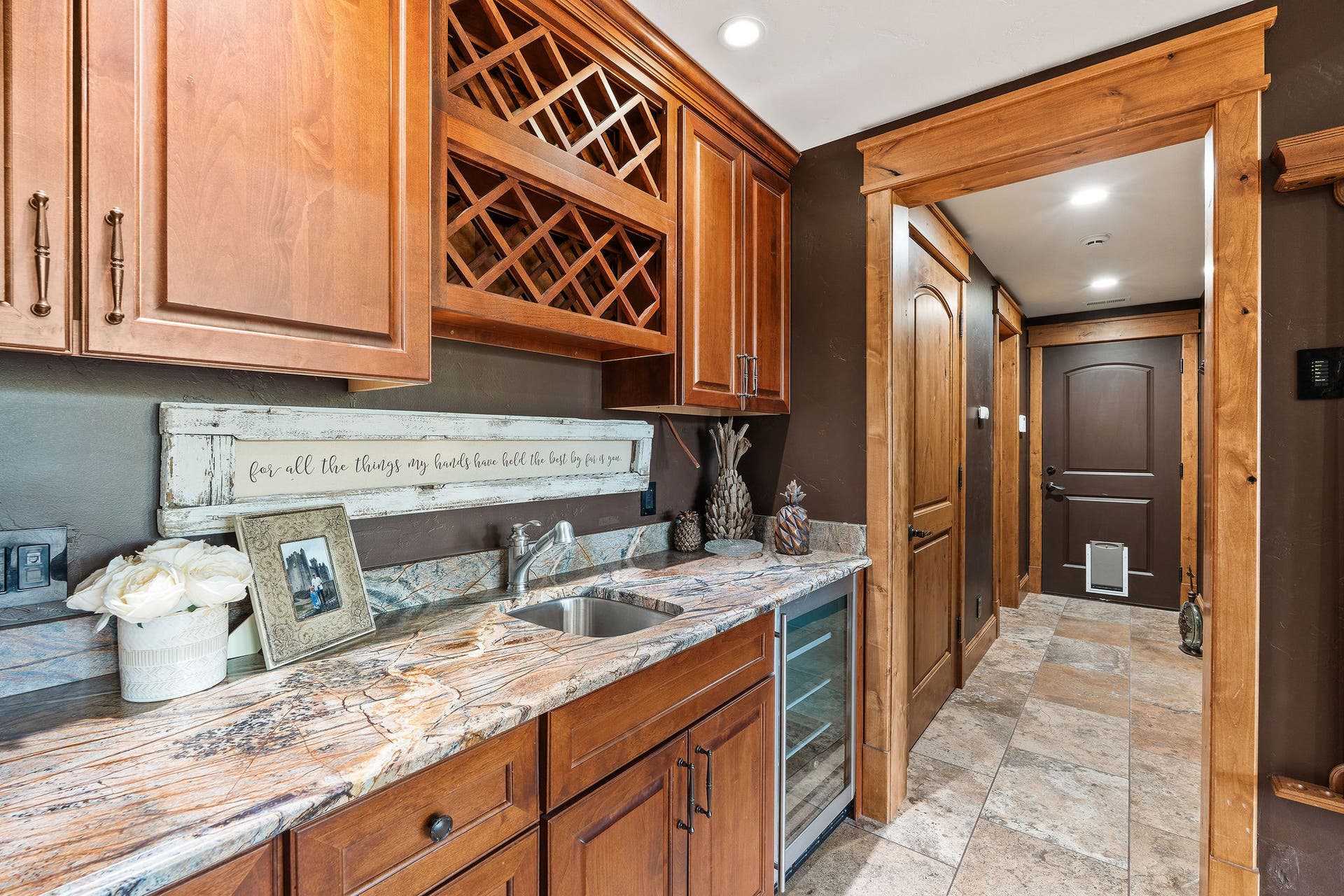 310 Rocky Woods Lane, Bigfork, MT 59911 Wet bar with built-in cherry cabinets, wine fridge & wine rack