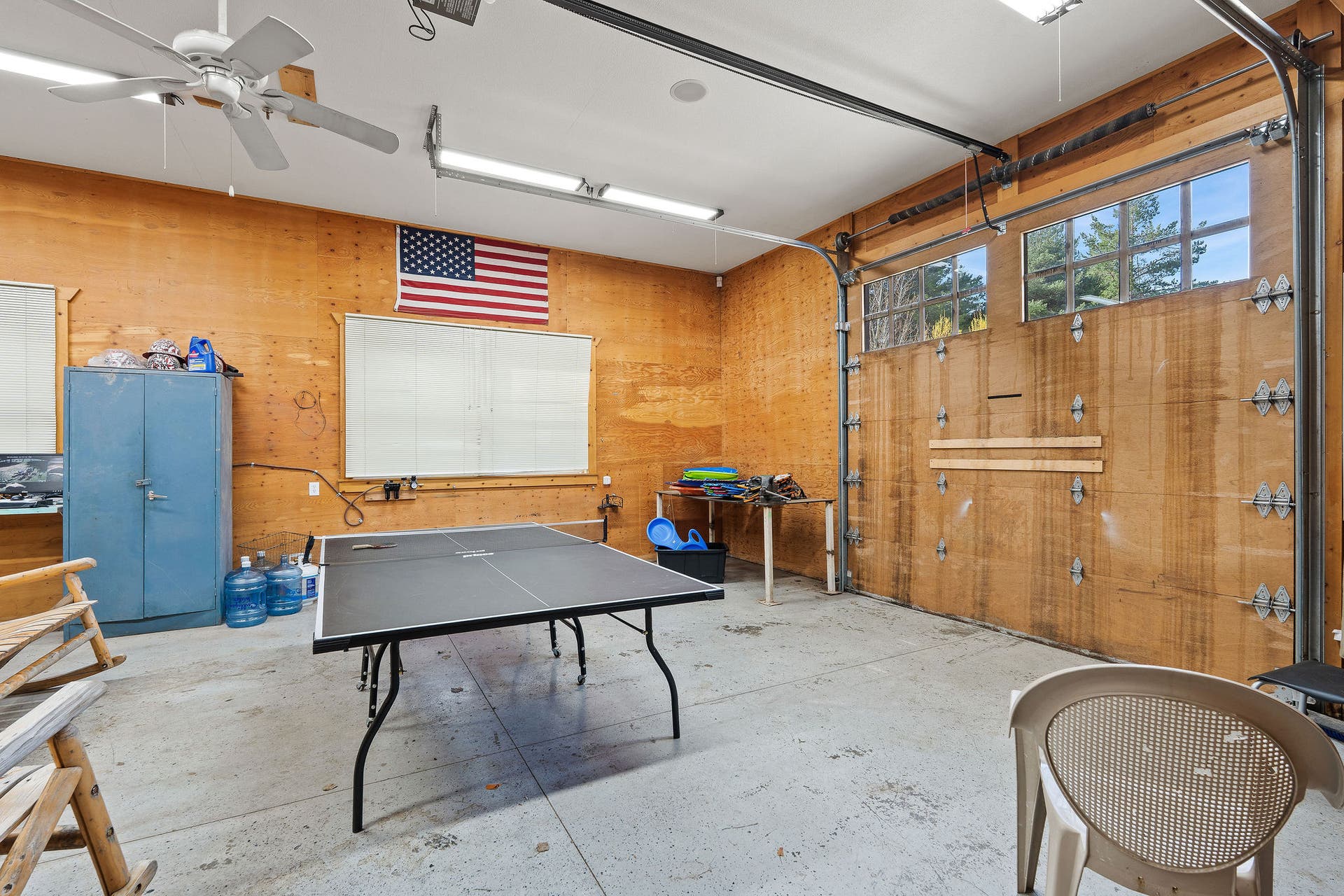 310 Rocky Woods Lane, Bigfork, MT 59911 Garage space attached to barndominium with storage shelves & cabinets