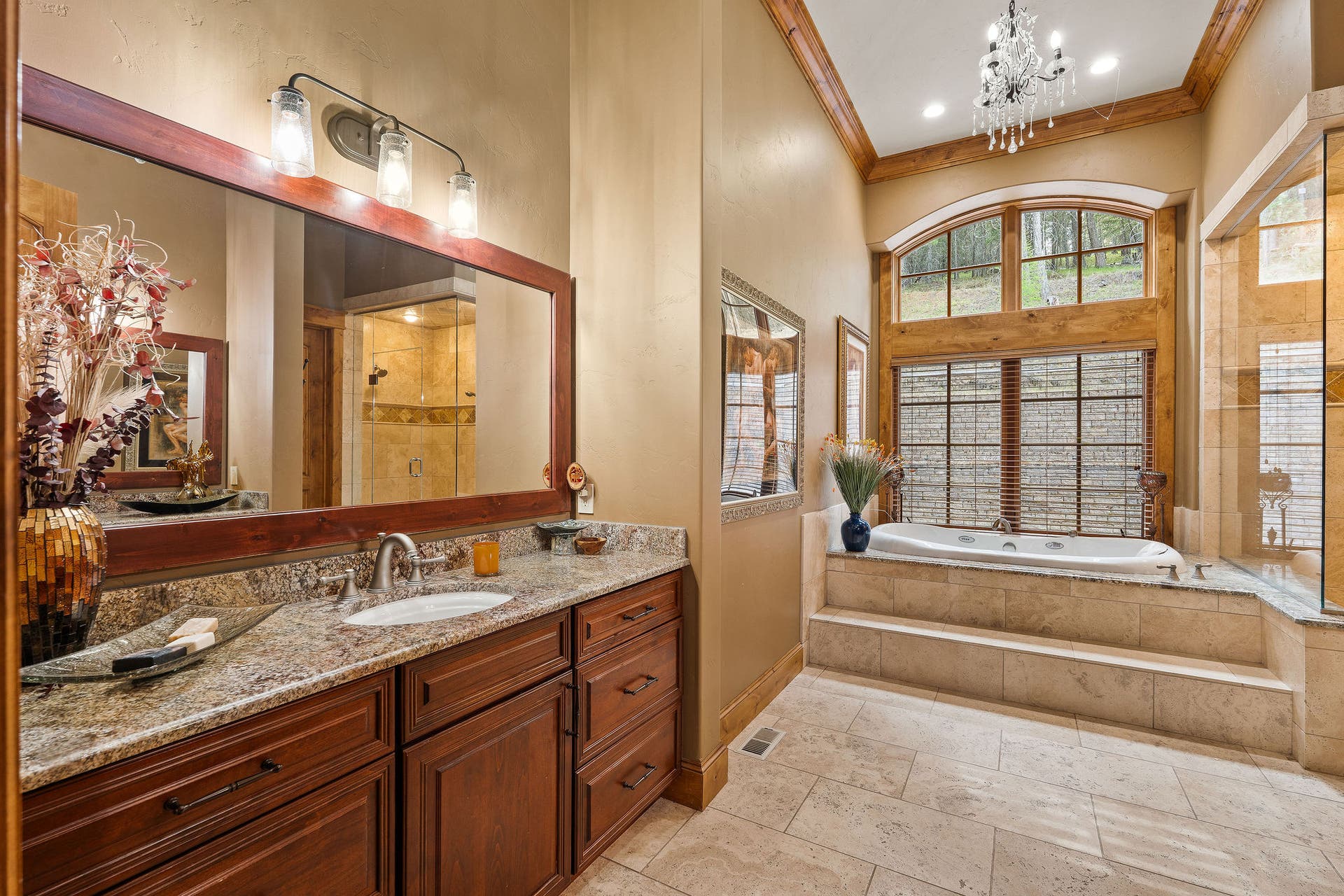 310 Rocky Woods Lane, Bigfork, MT 59911 Dual vanity with granite countertops, travertine tile radiant floor