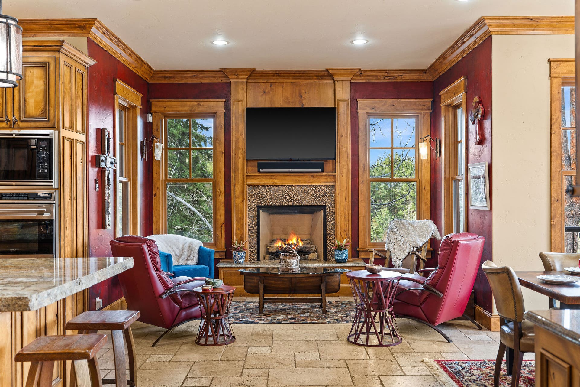 310 Rocky Woods Lane, Bigfork, MT 59911 Sitting area with gas fireplace and mounted TV