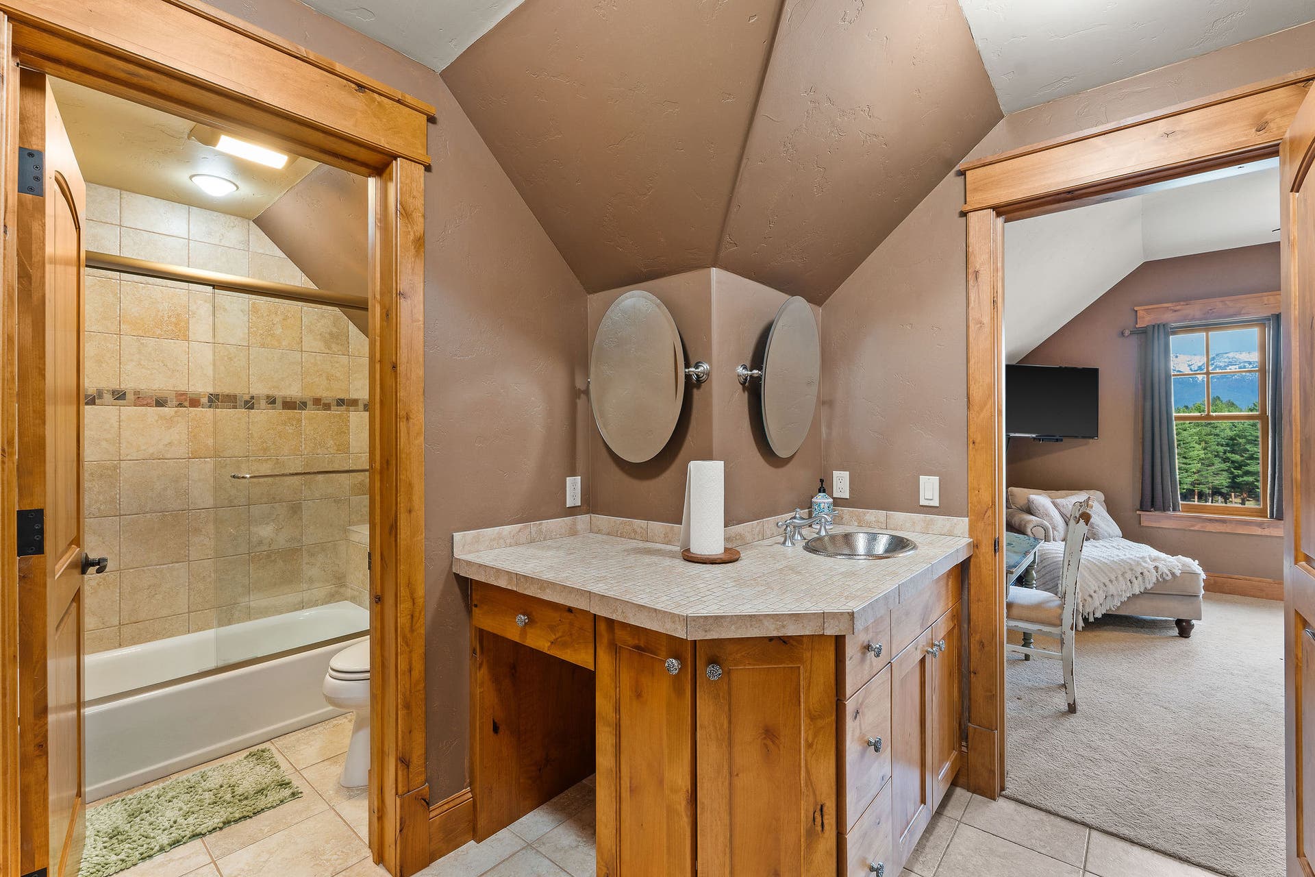 310 Rocky Woods Lane, Bigfork, MT 59911 Jack & Jill full bathroom accessed from Guest Bedrooms #2 & #3, radiant tile floor