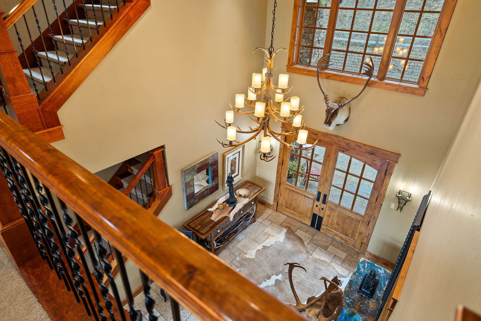 310 Rocky Woods Lane, Bigfork, MT 59911 Iron & wood railing overlooking foyer and Great Room