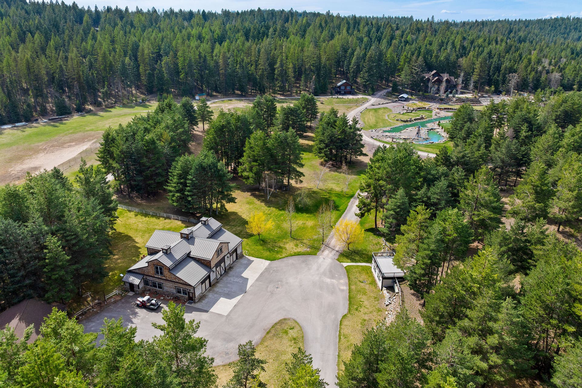 310 Rocky Woods Lane, Bigfork, MT 59911 Barndominium, detached garage, and underground range