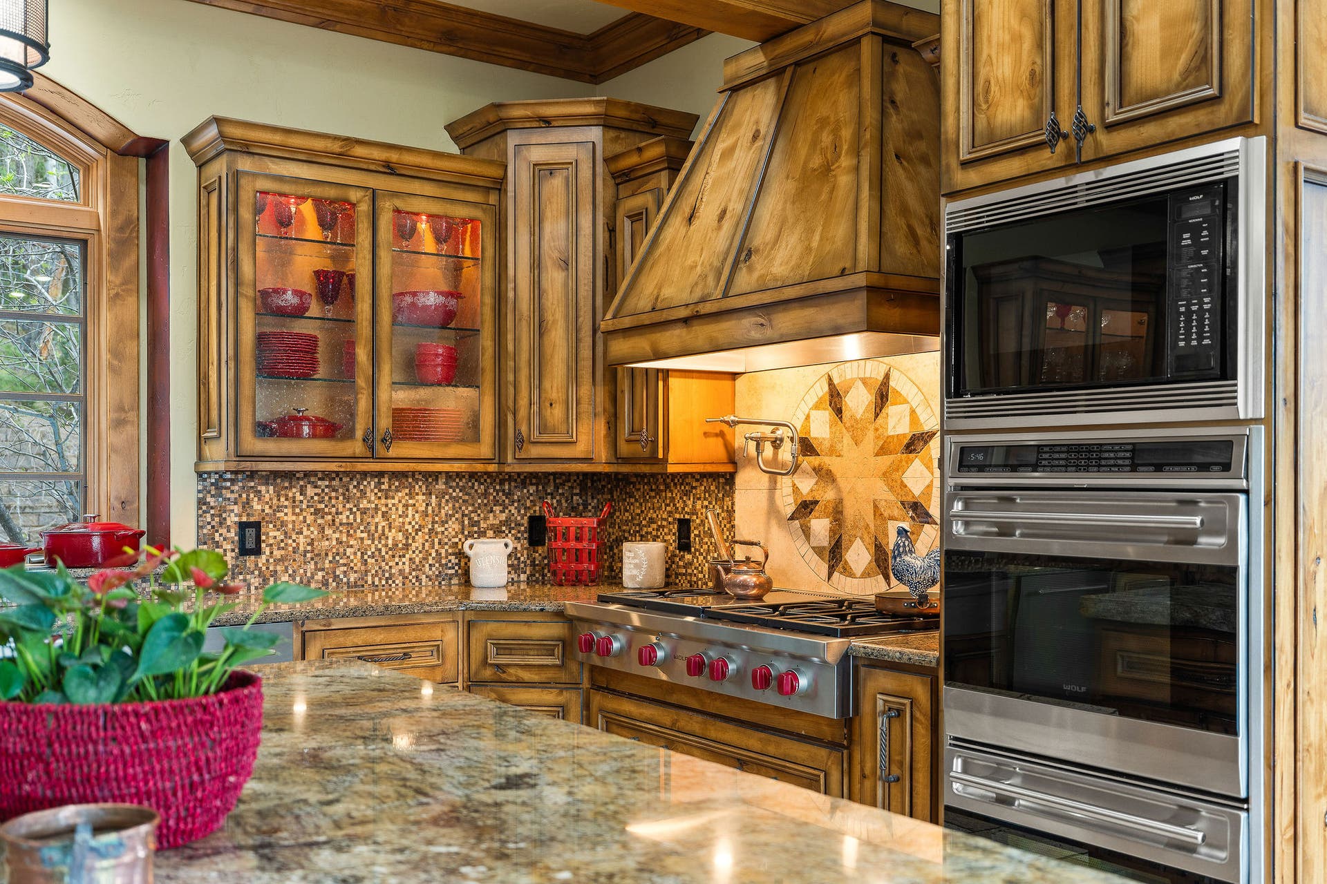 310 Rocky Woods Lane, Bigfork, MT 59911 Dual Wolf convection ovens, 6-burner gas cooktop, knotty alder hood