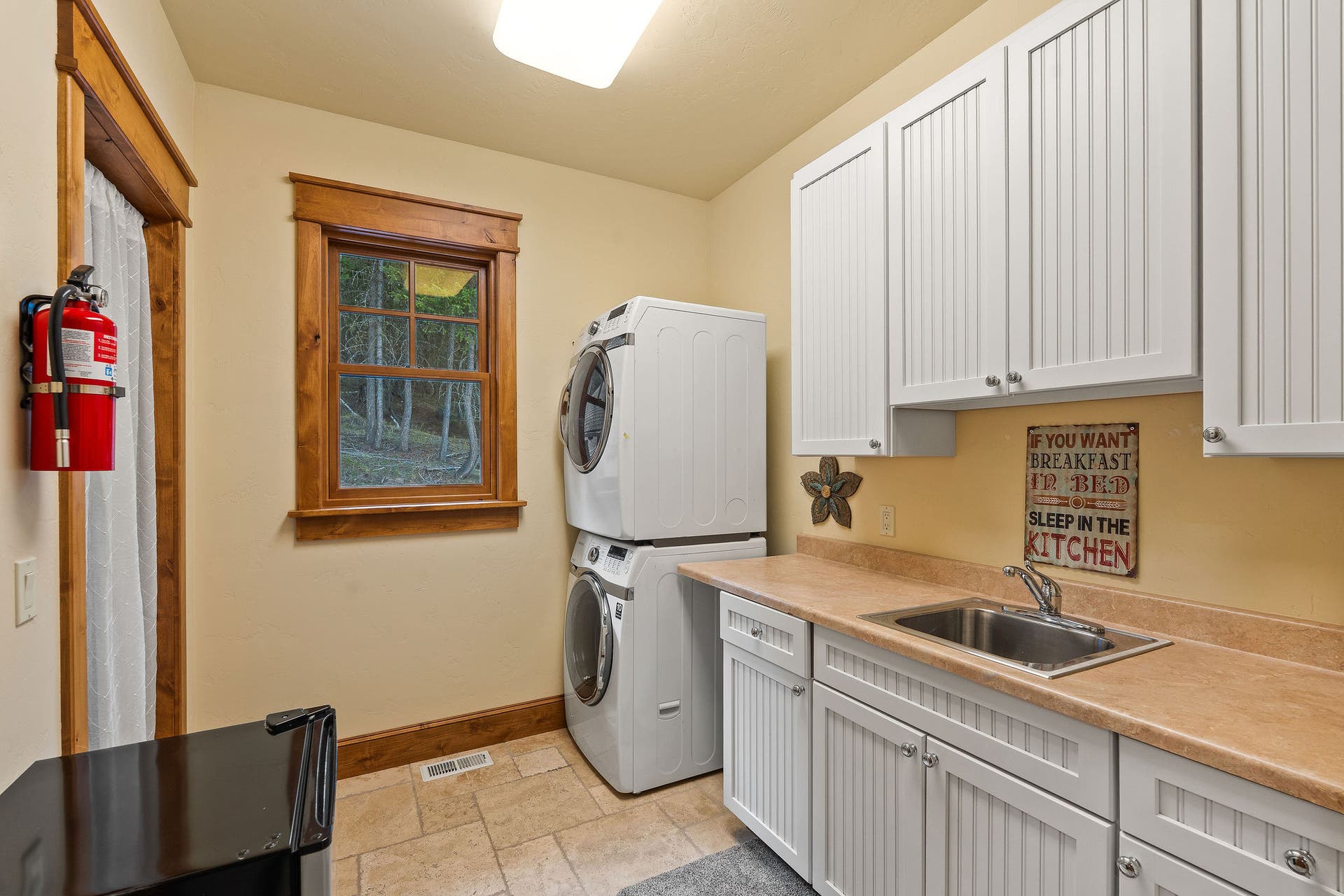 310 Rocky Woods Lane, Bigfork, MT 59911 2nd Level Laundry Room: sink, closet, tile flooring
