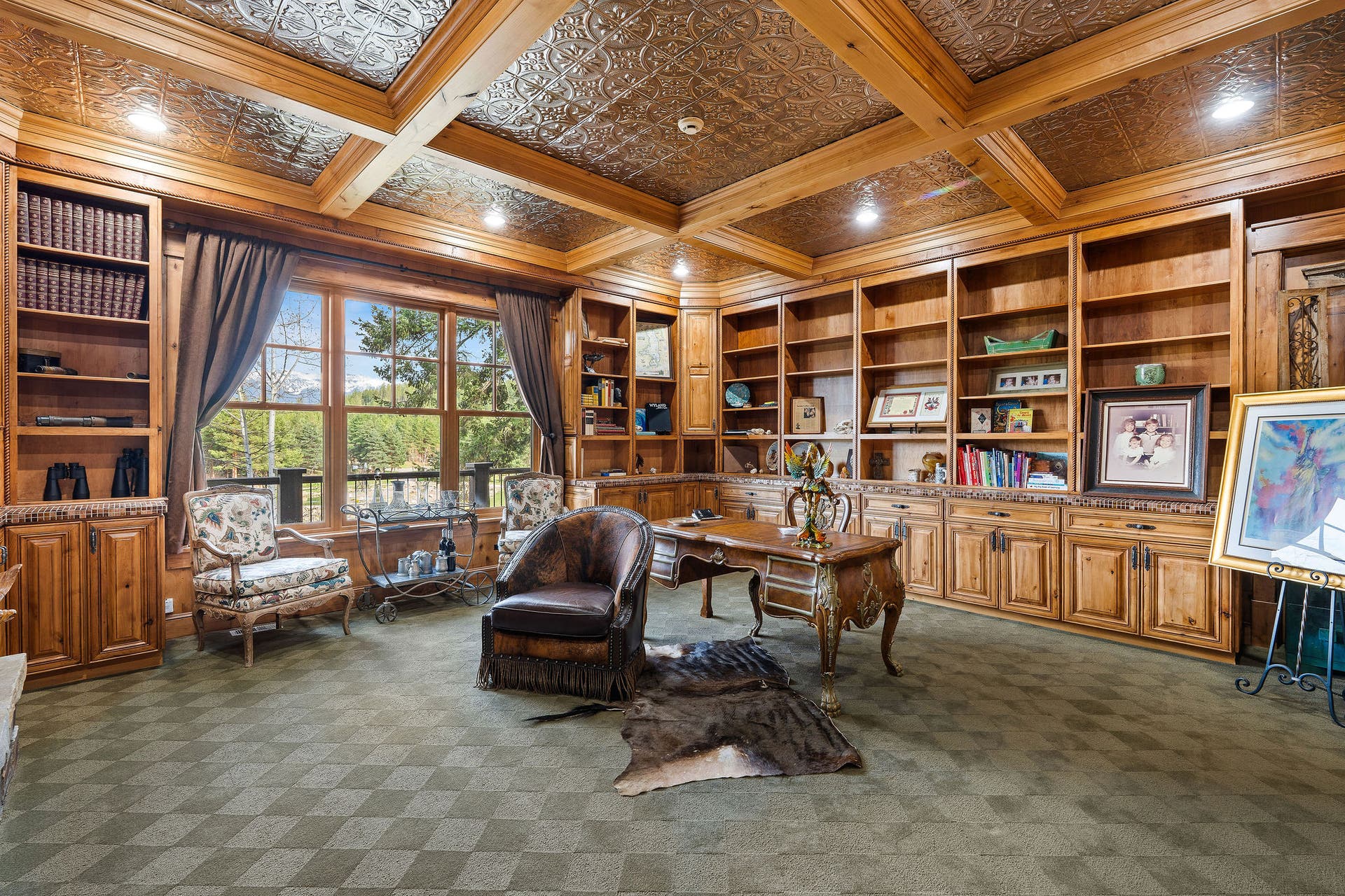 310 Rocky Woods Lane, Bigfork, MT 59911 Library/office with knotty alder cabinets, mosaic tile countertops