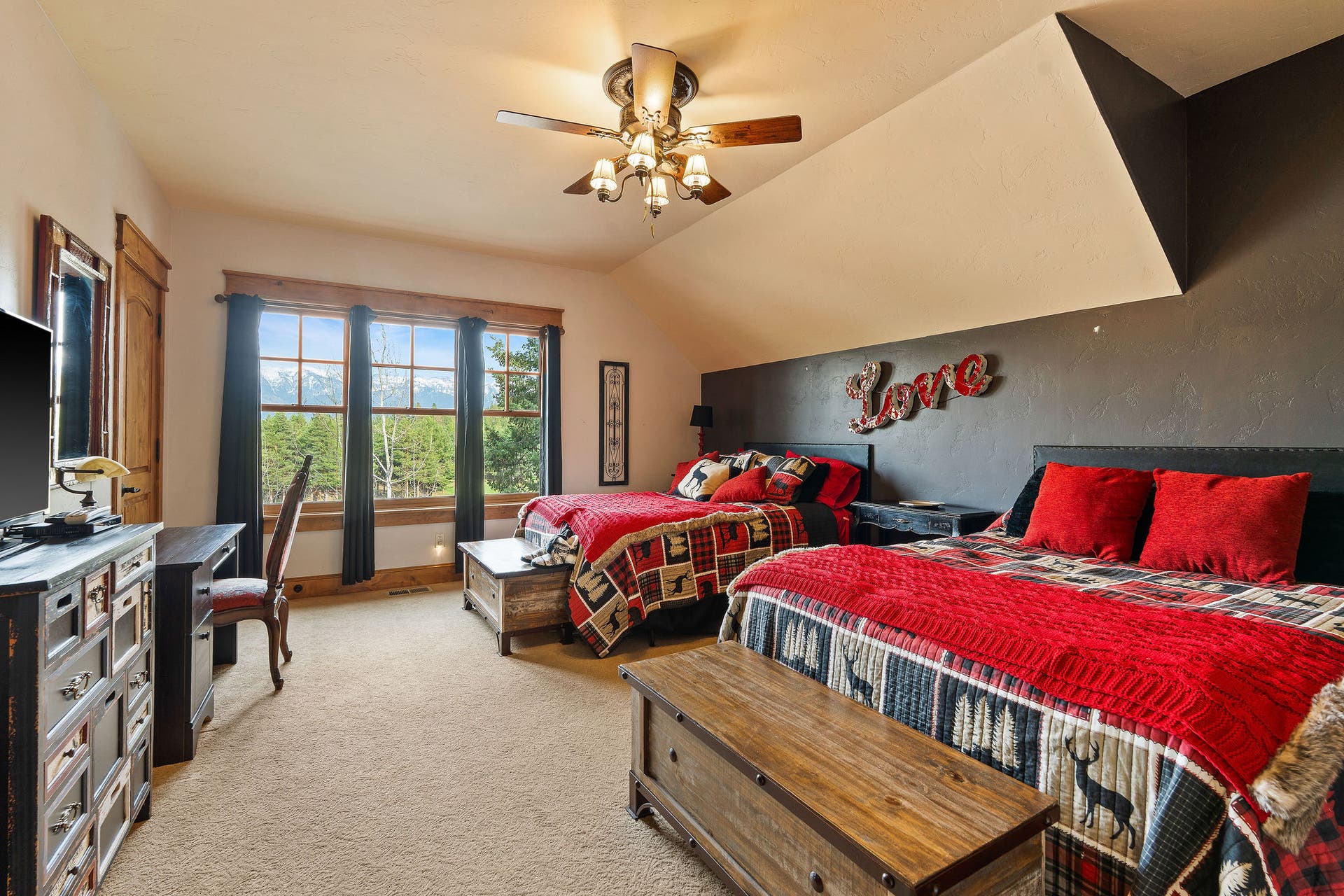 310 Rocky Woods Lane, Bigfork, MT 59911 2nd Level Guest Bedroom #1 (South): Swan Mtn Range views, high ceilings, ensuite full bath