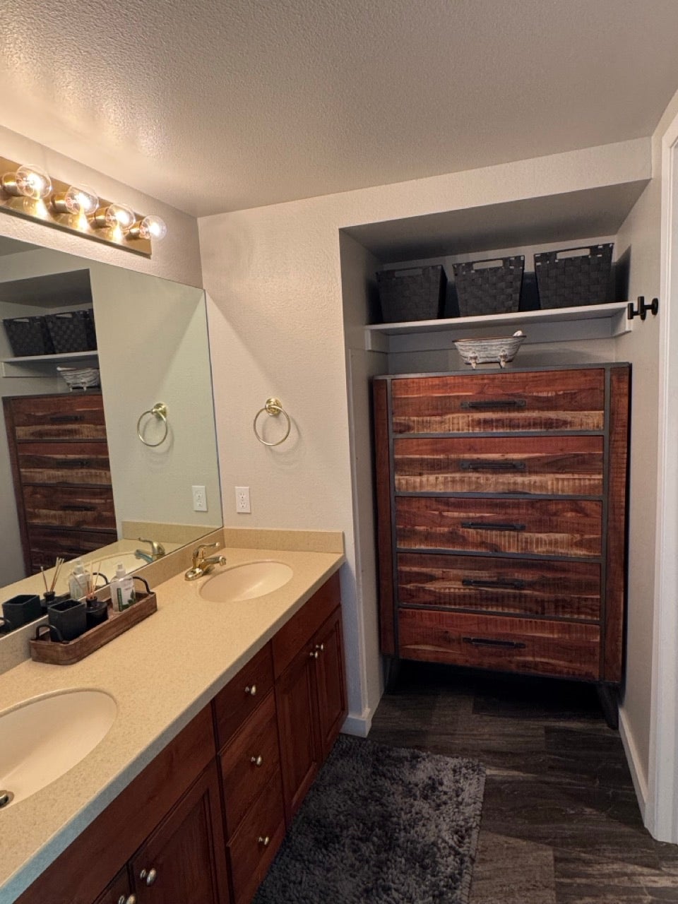 Double vanity with integrated sinks and a light-toned countertop