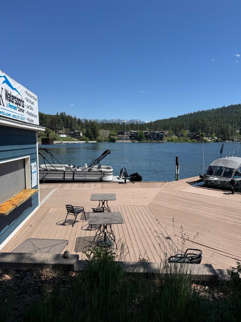 Expansive wood-finish dock with waterfront access