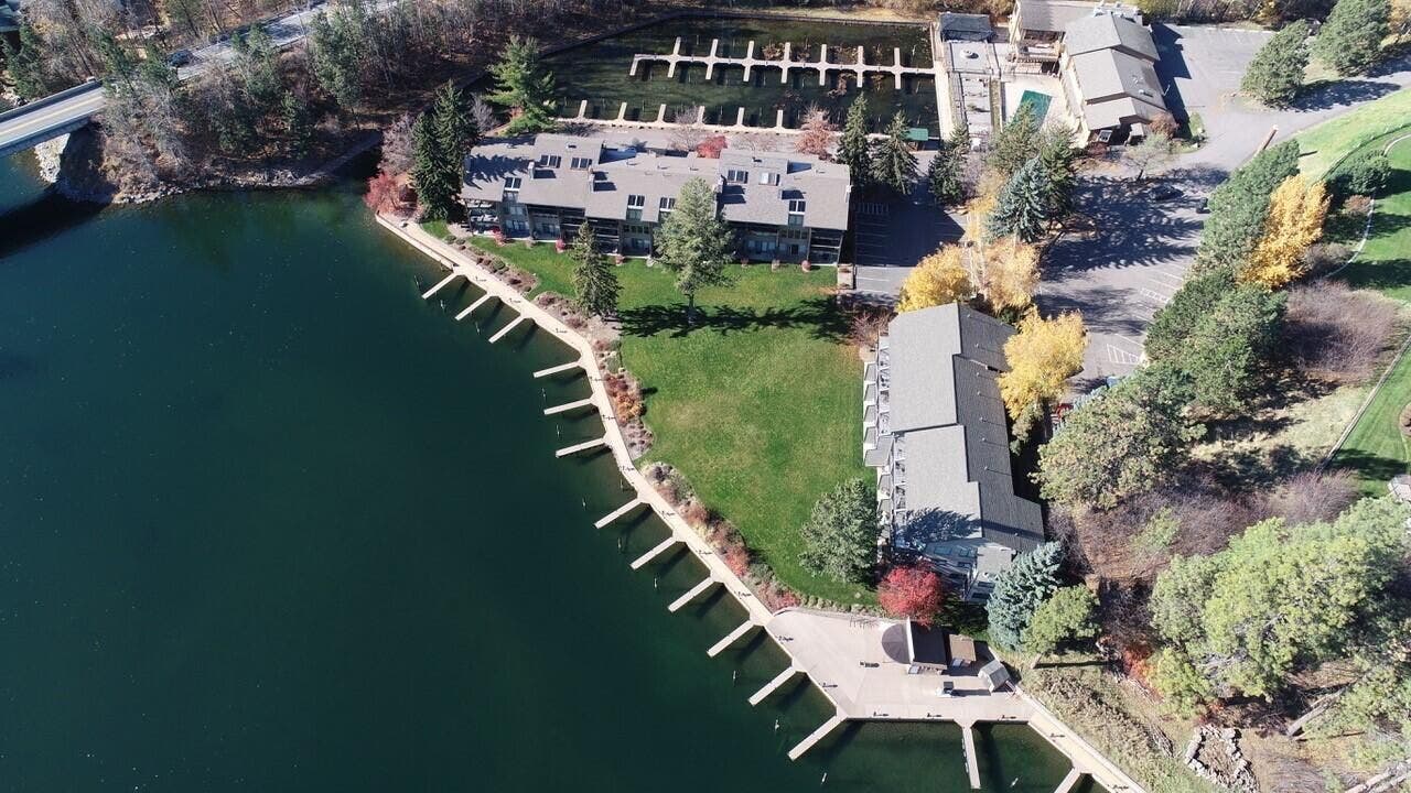 Waterfront property featuring multiple buildings, private boat docks, and direct water access