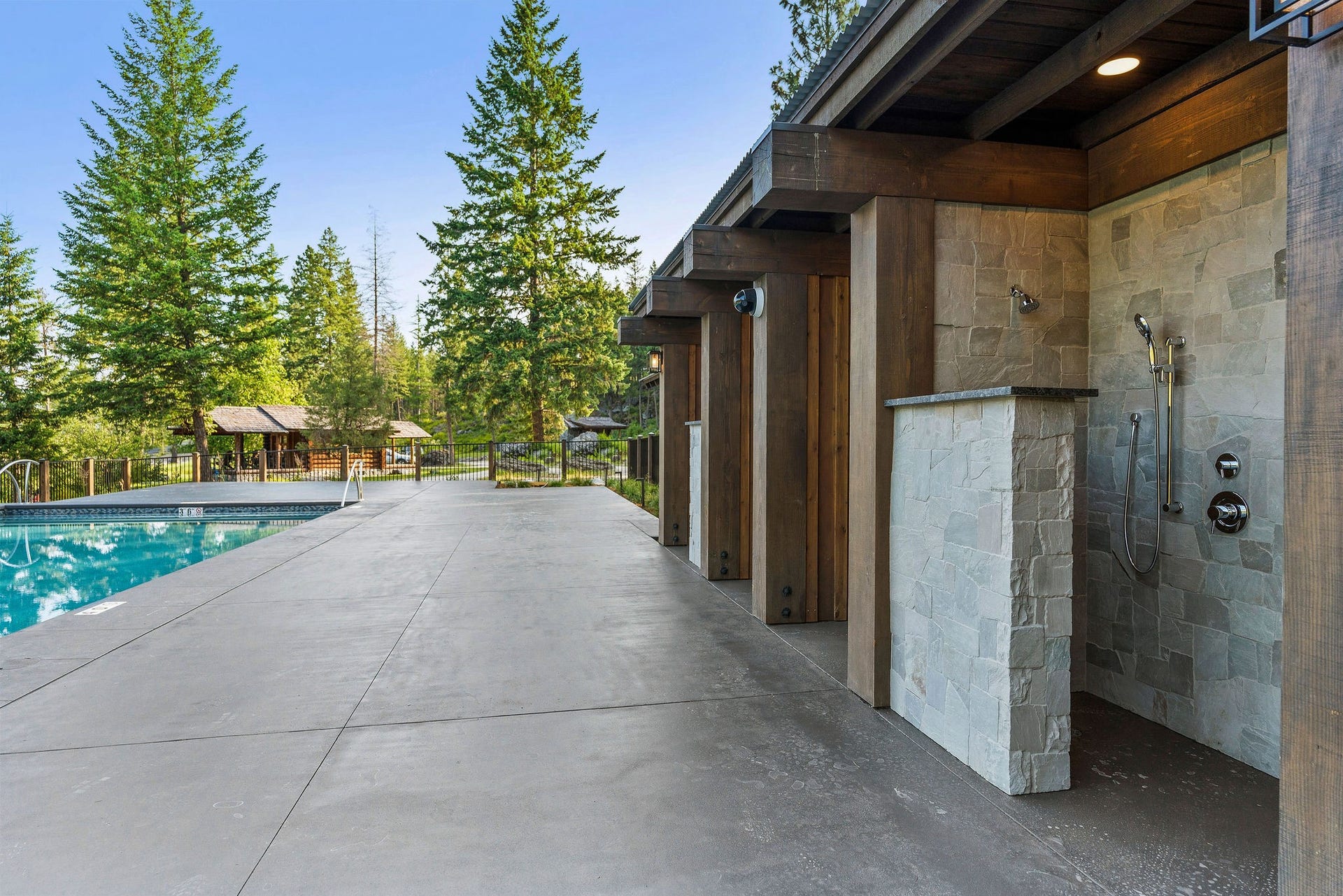 477 Chief Cliff Trail, Bigfork, MT 59911 Saddlehorn Pool Outdoor Shower Area