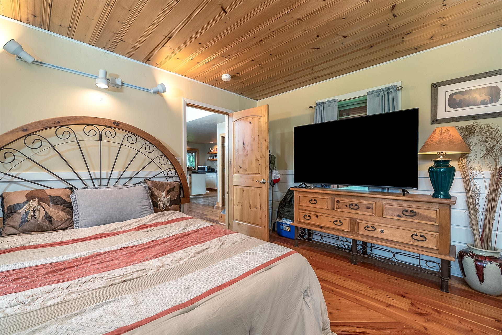 777 Mt Highway 83, Bigfork, MT 59911 Wood-finish plank flooring and a wood-paneled ceiling establish rustic charm