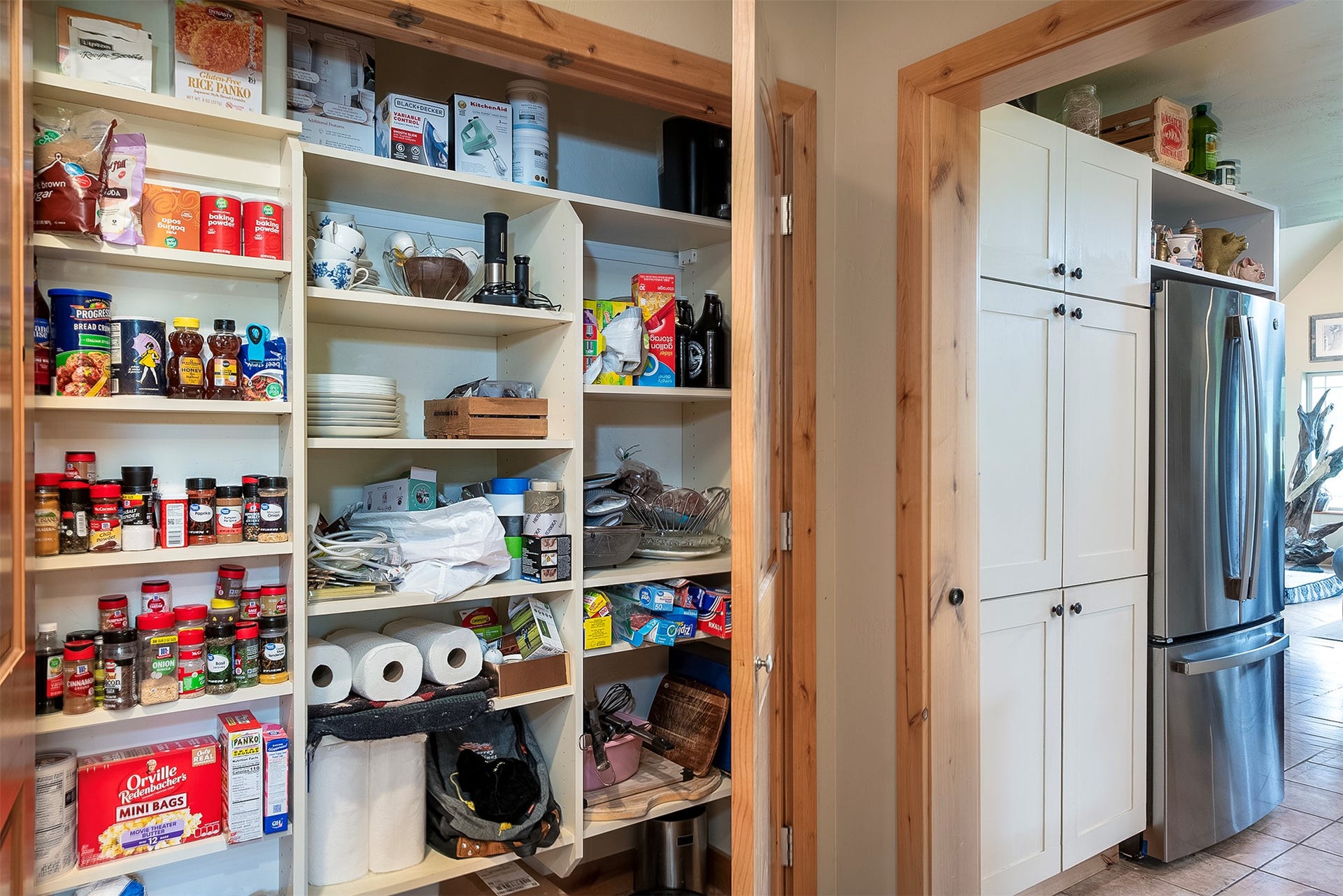 777 Mt Highway 83, Bigfork, MT 59911 Built-in pantry with light-toned wooden shelving and natural wood trim