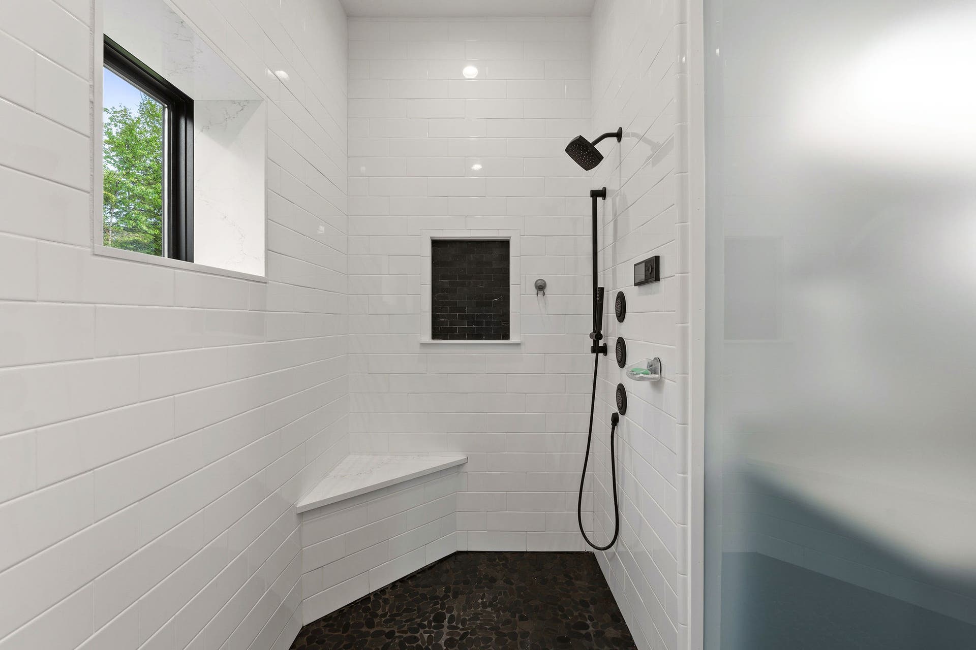 14051 Big Rock Way, Bigfork, MT 59911 Large step-in shower with pebble tile floor and bench seat