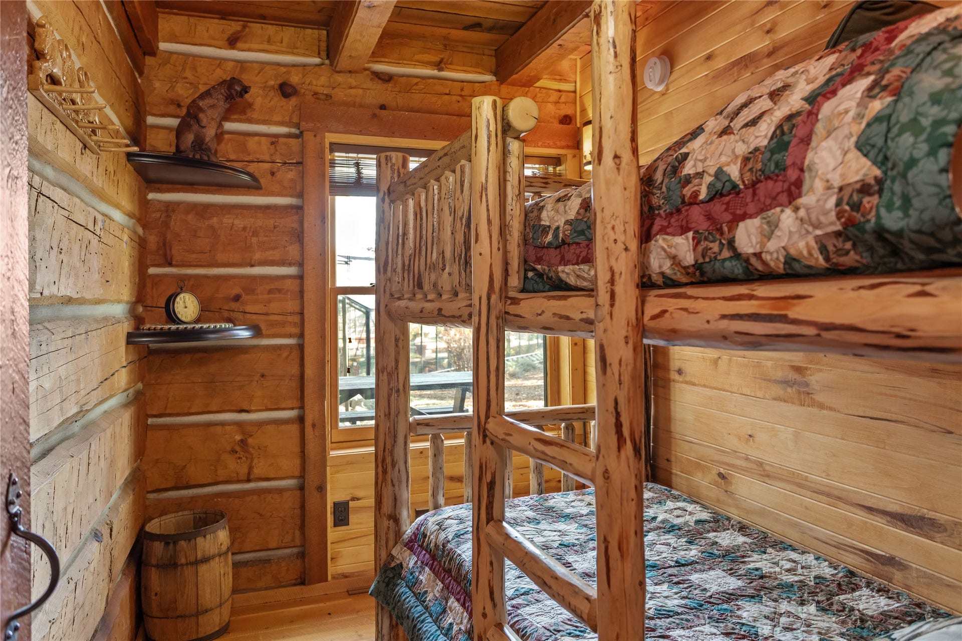 13518 Sylvan Drive, Bigfork, MT 59911 Bearly Asleep Cabin lower level bedroom with log bunk beds